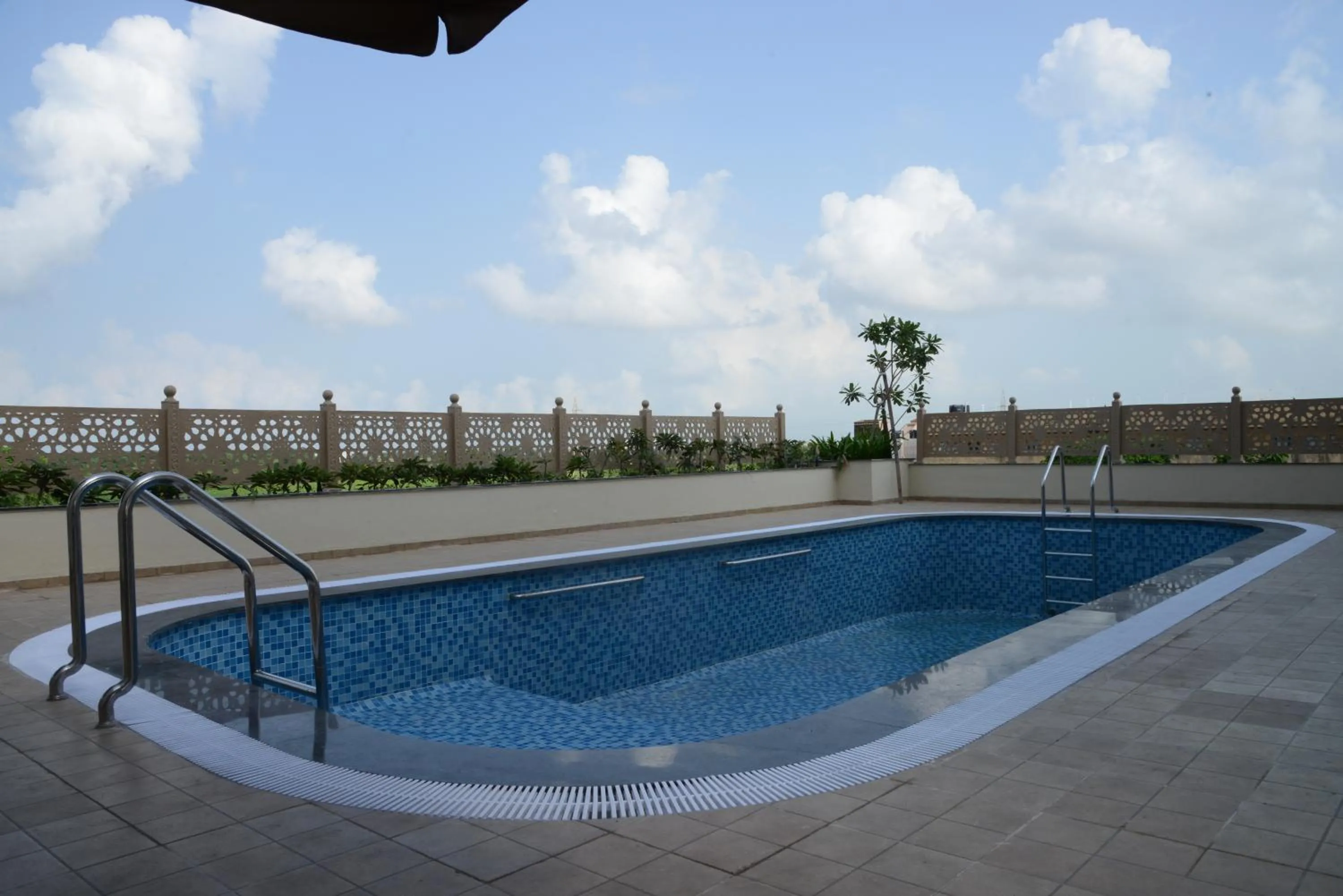 Swimming pool in Lords Inn Jamnagar -Motikhavdi