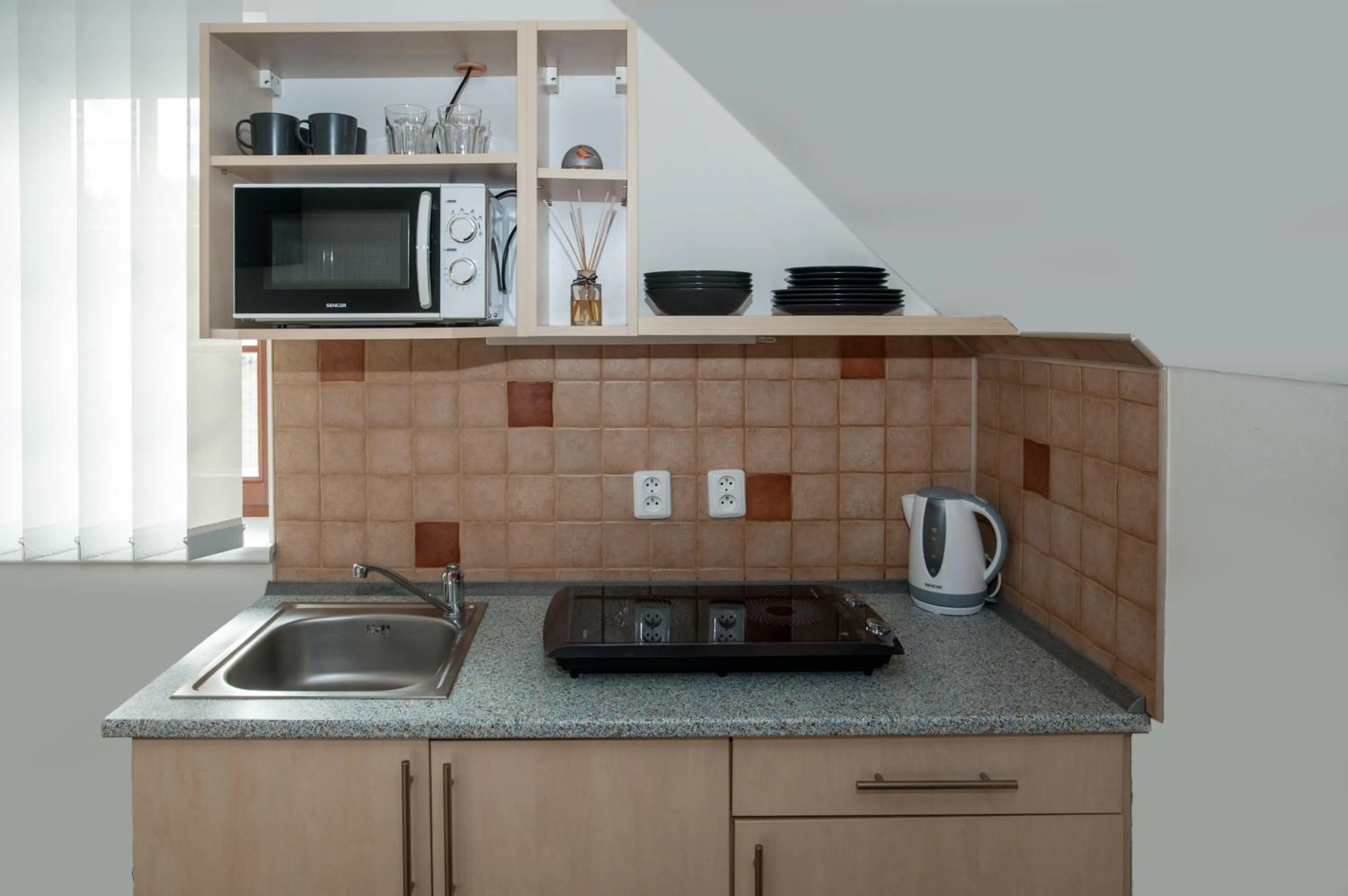 Kitchen or kitchenette in Čerti Apartmány