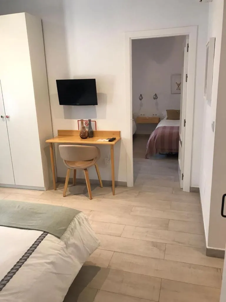 Photo of the whole room, TV/Entertainment Center in Chipibeach, Hostal Boutique