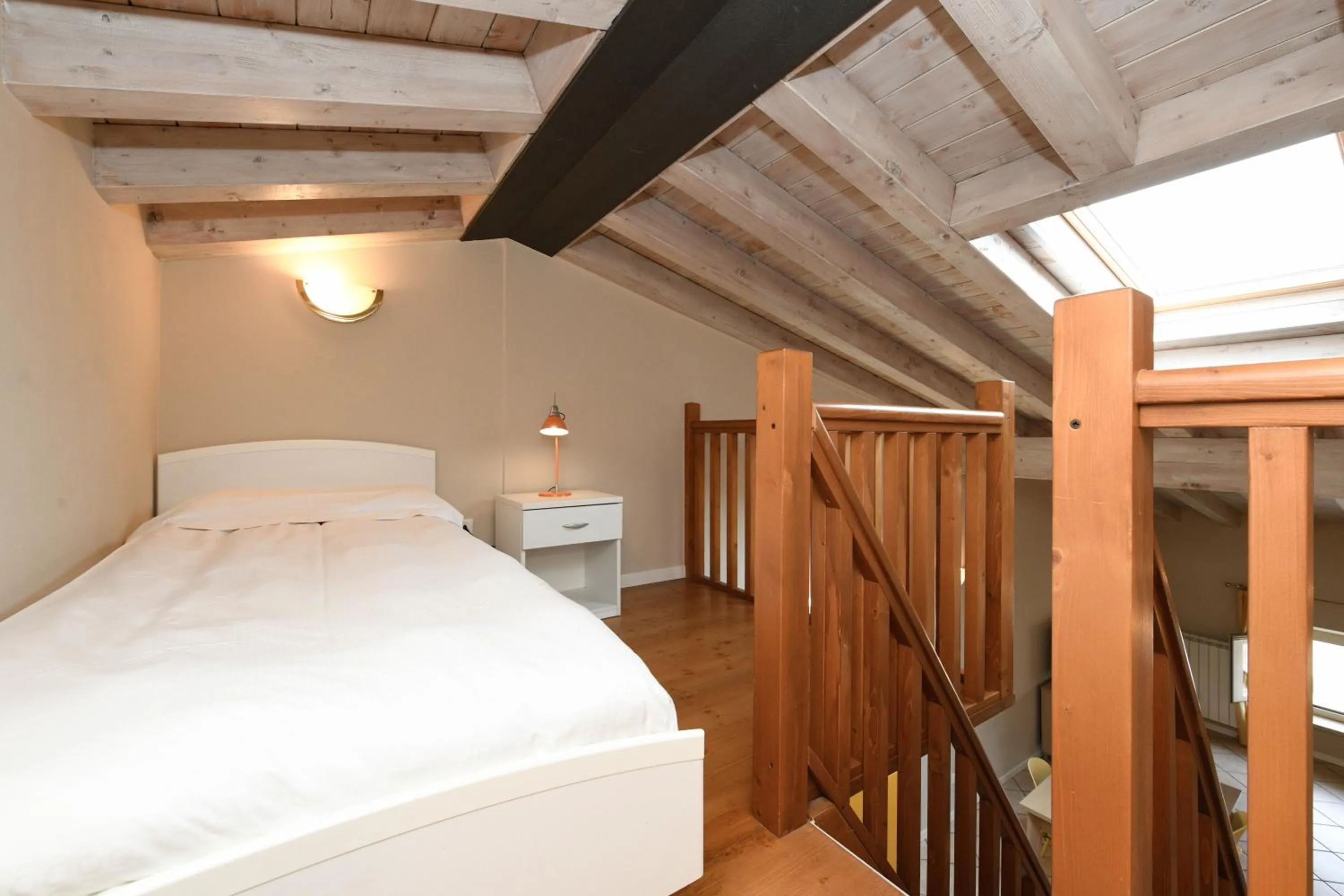 Bed in Flowers Apartments