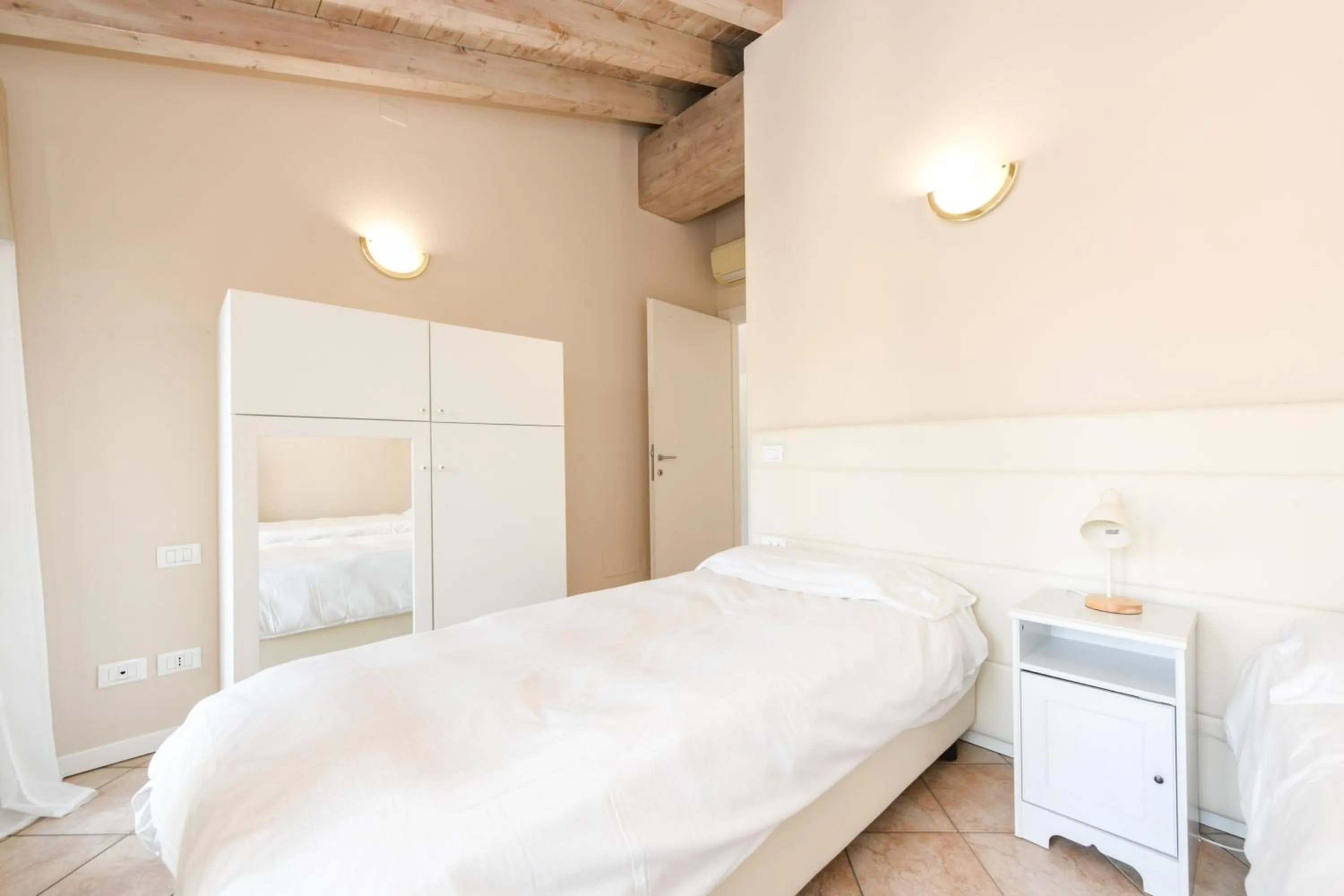 wardrobe, Bed in Flowers Apartments