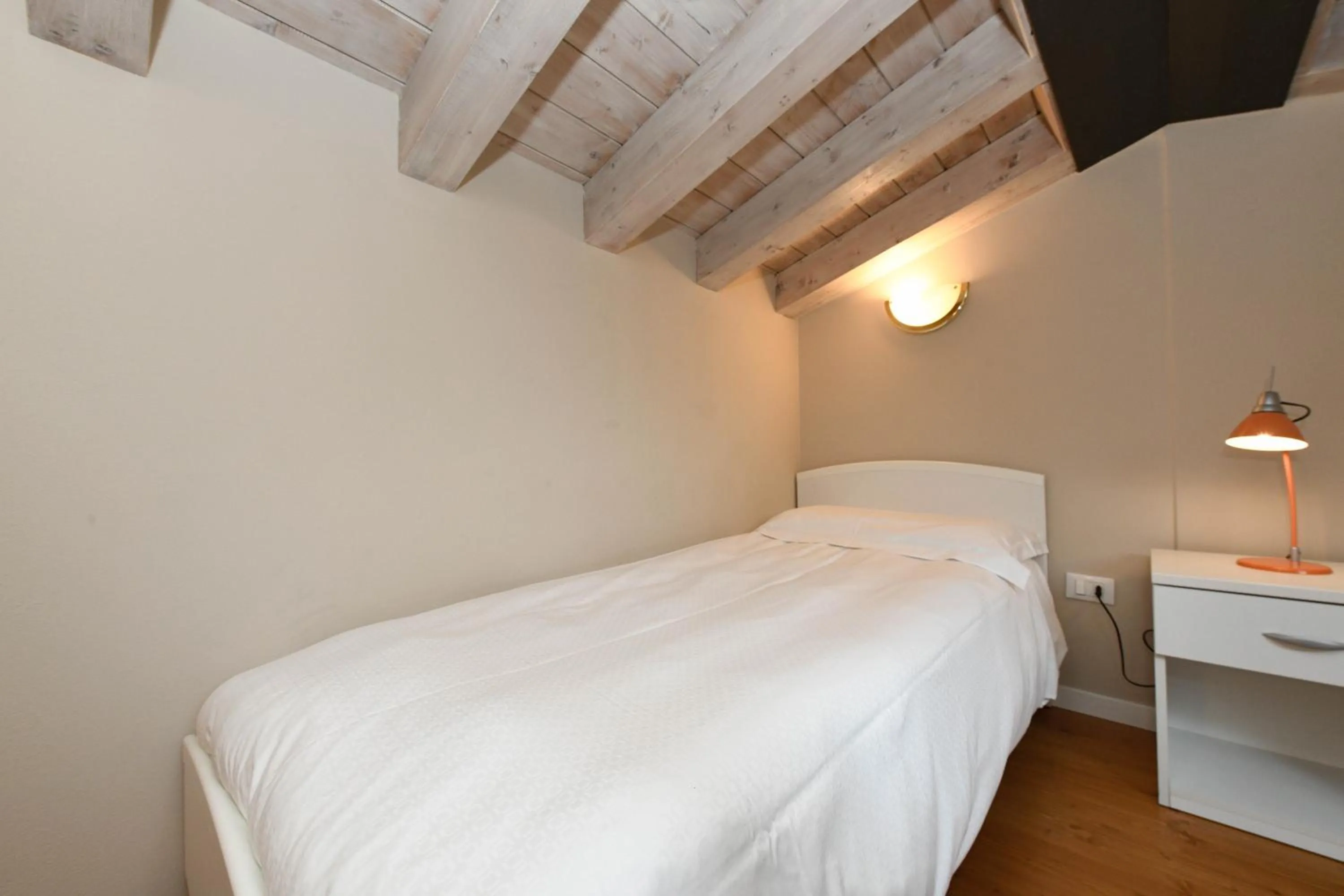 Bed in Flowers Apartments