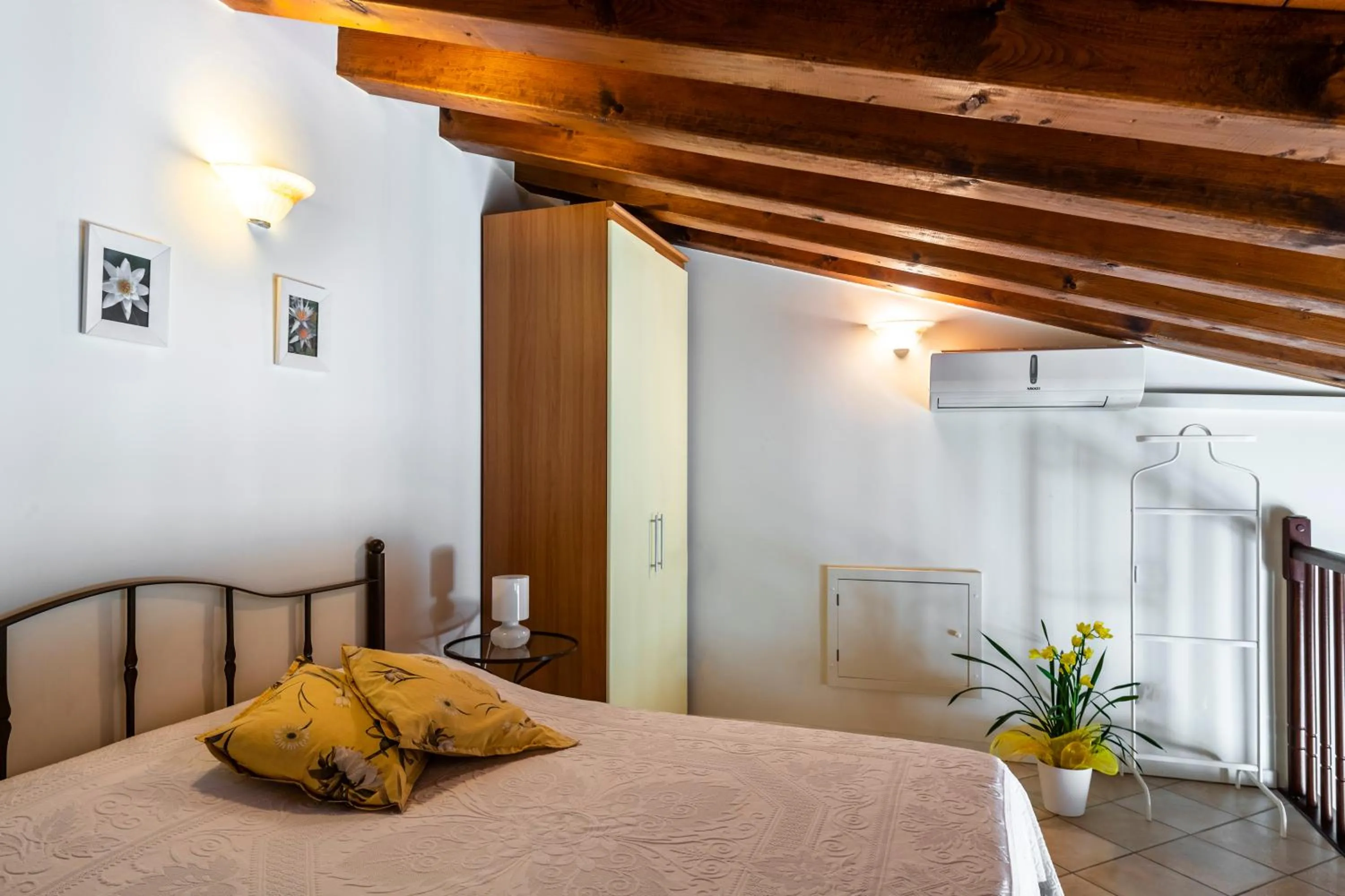 Bed in Flowers Apartments