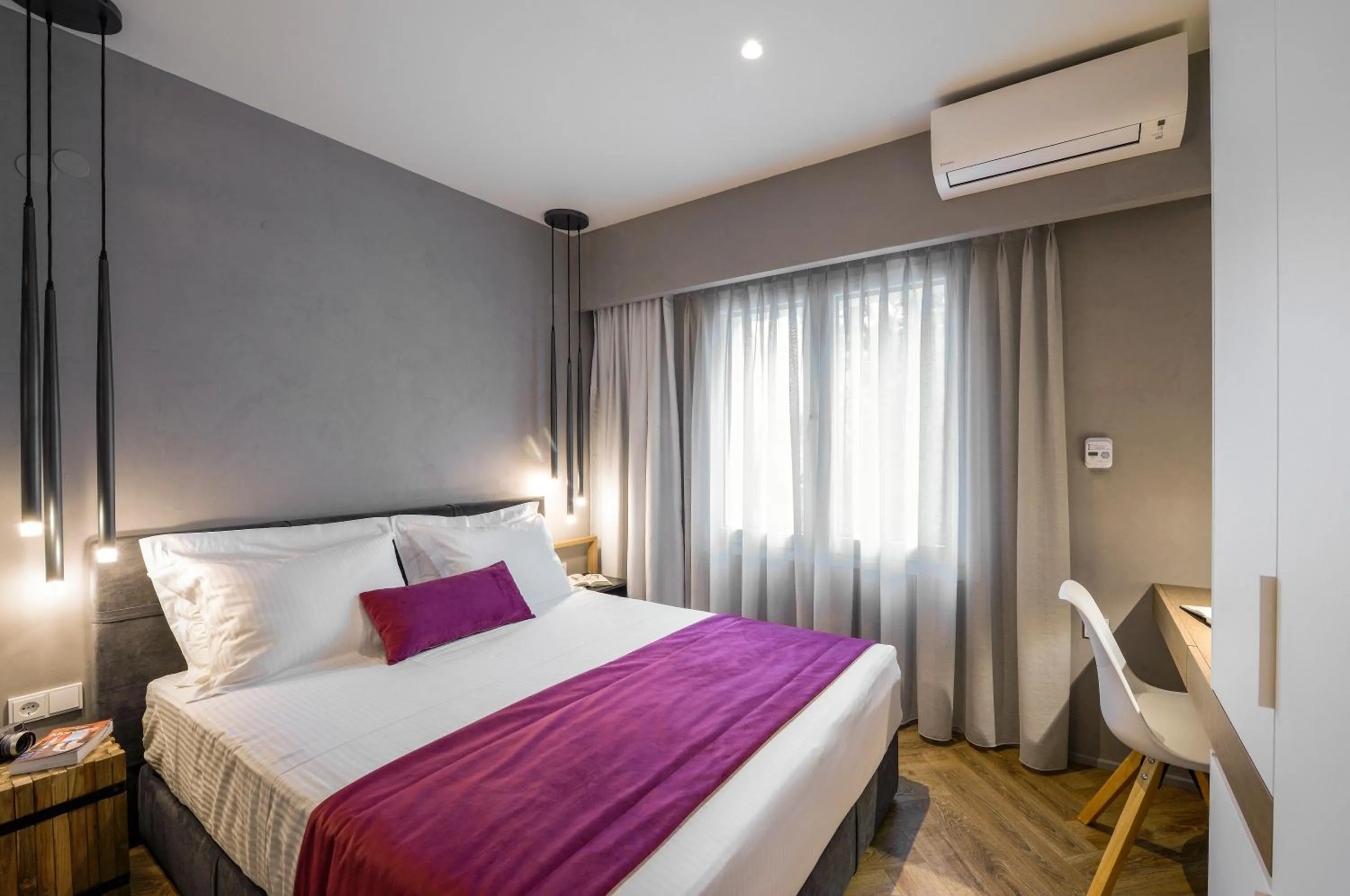 Bed in Olvios Luxury Suites