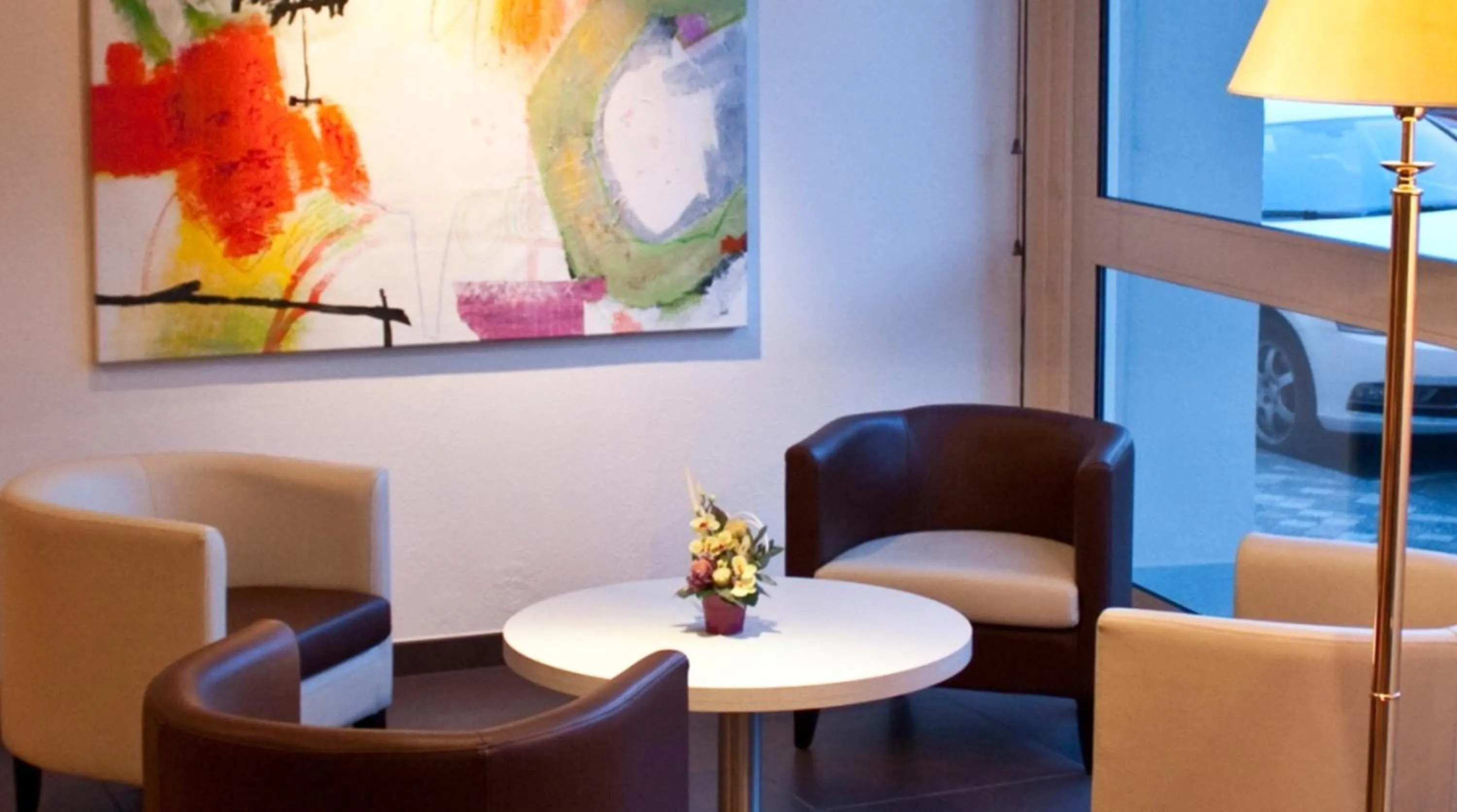 Communal lounge/ TV room in BRIT HOTEL Confort Le Limouzi TULLE