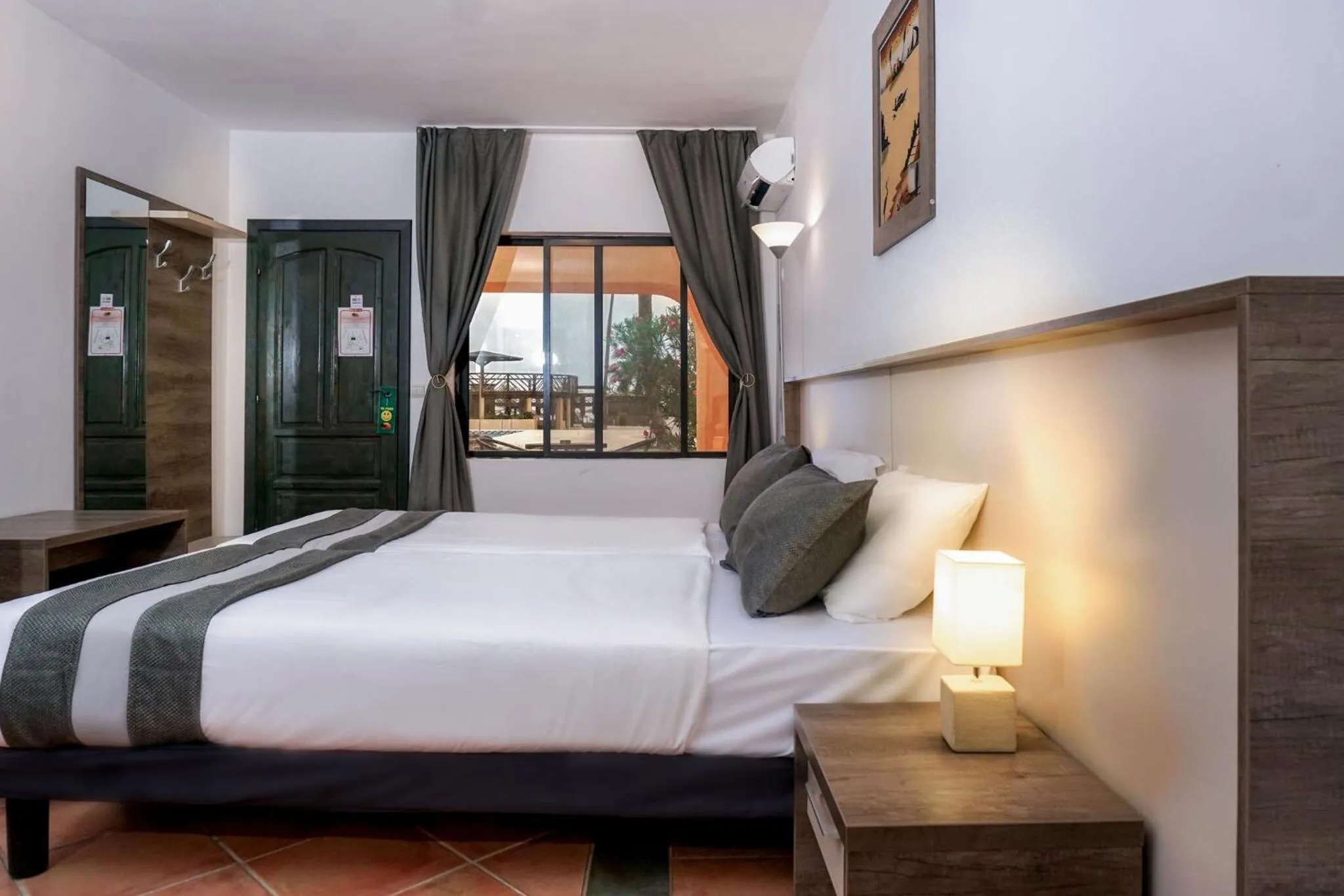 Bed in Sunbeach Hotel & Resort