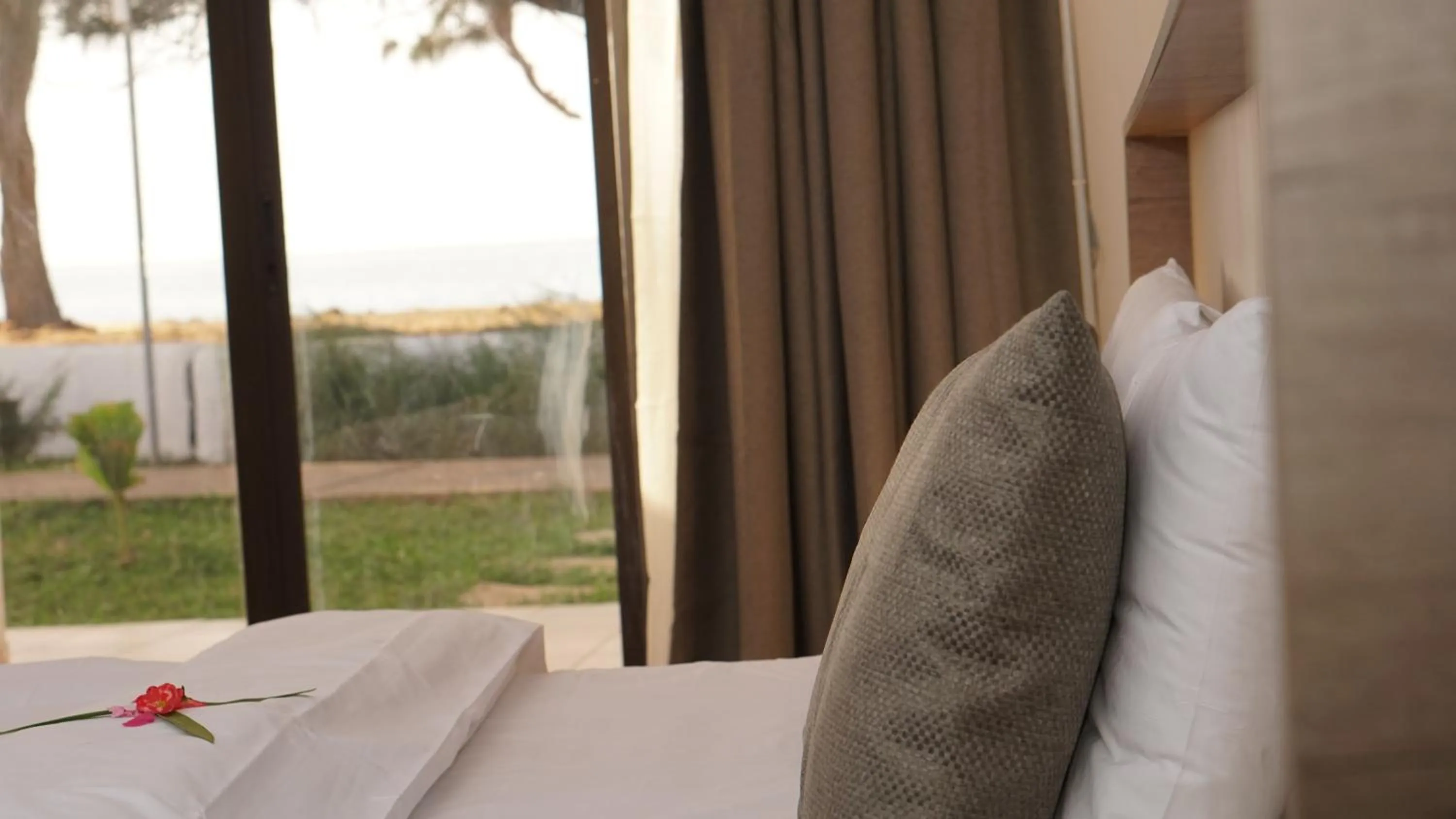 Bed in Sunbeach Hotel & Resort