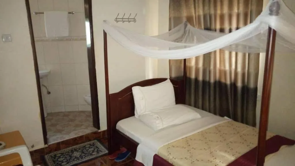 Bedroom in Kalalo Cottage Inn