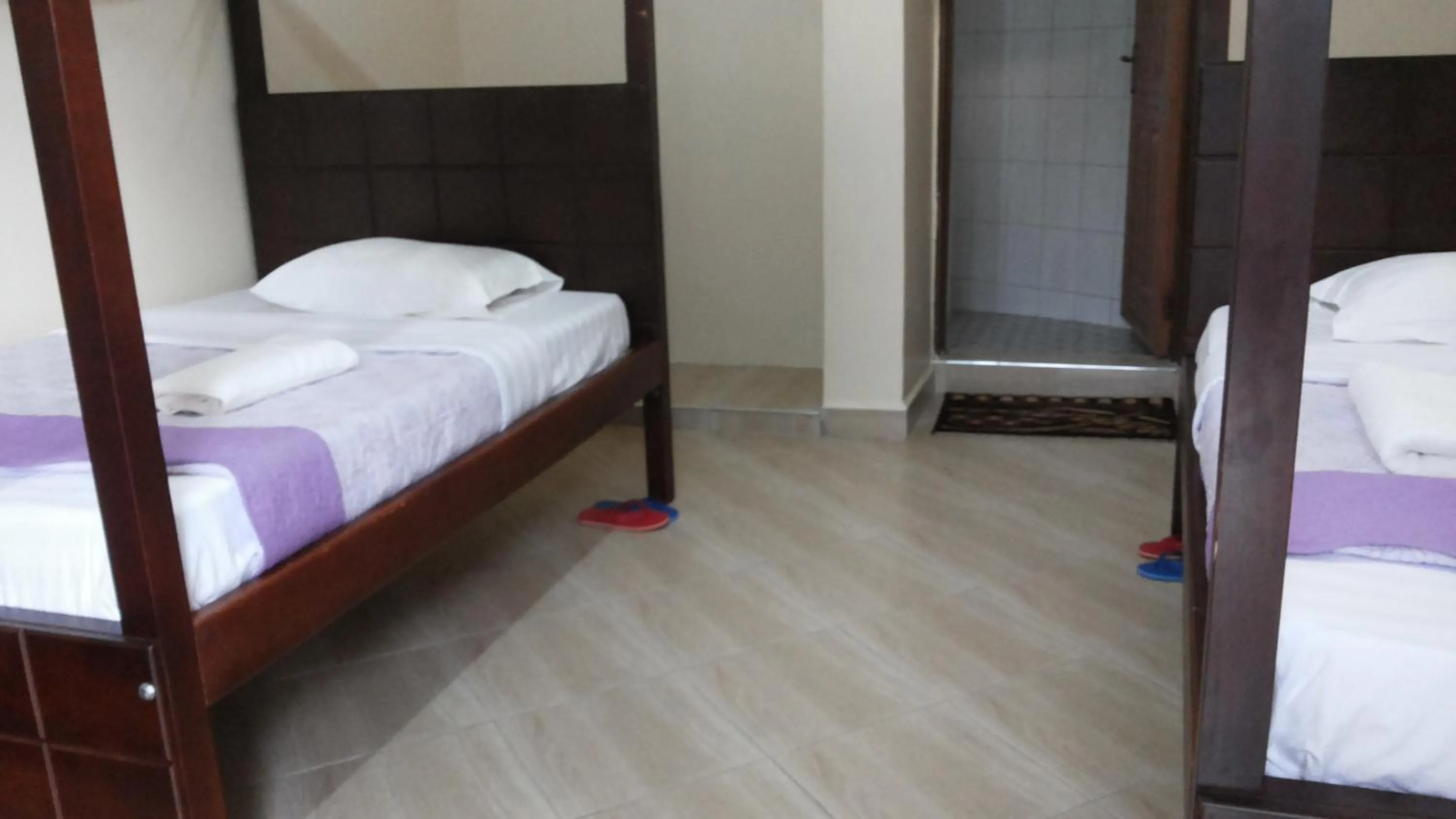 Bed in Kalalo Cottage Inn