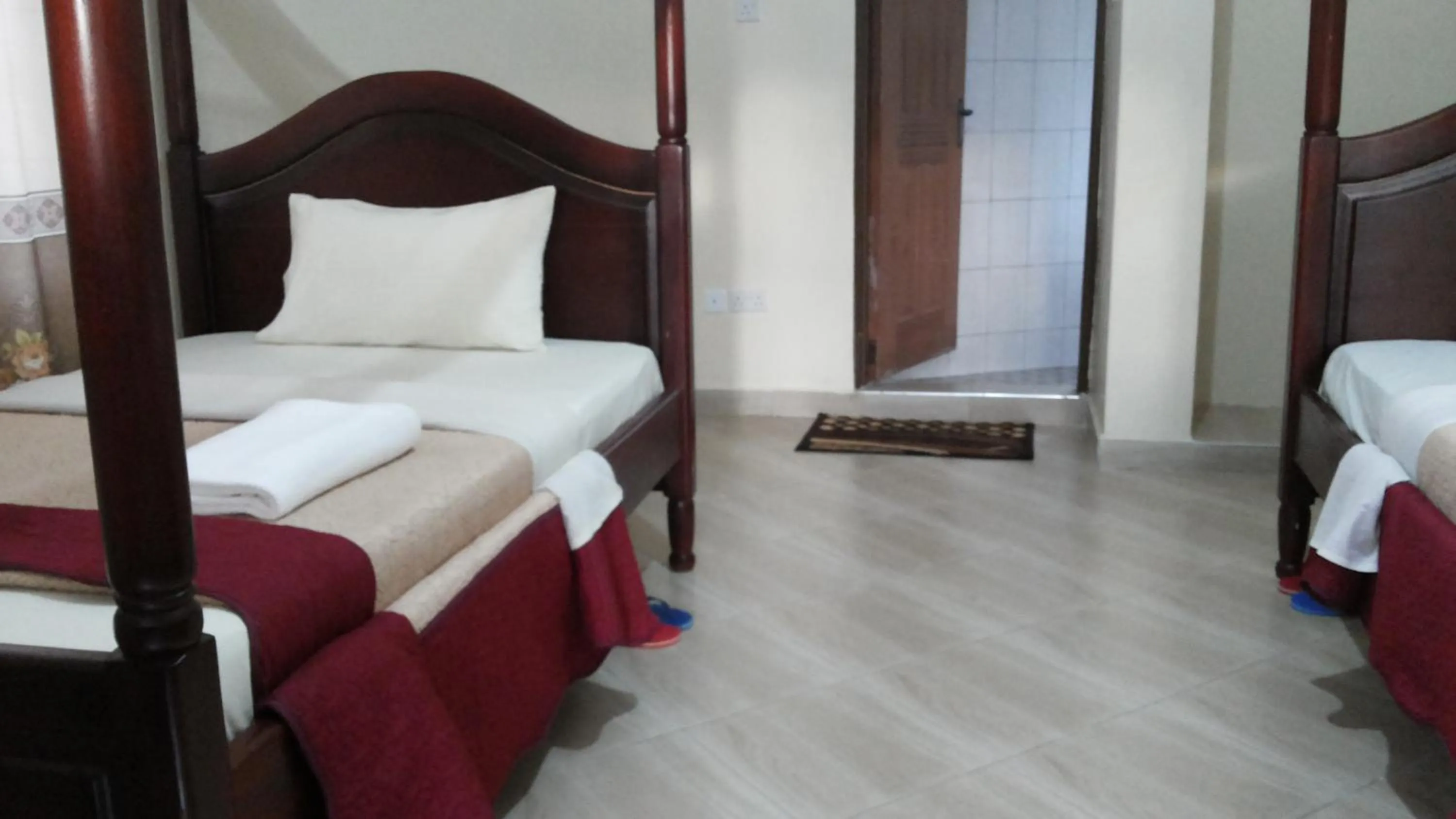 Bedroom in Kalalo Cottage Inn