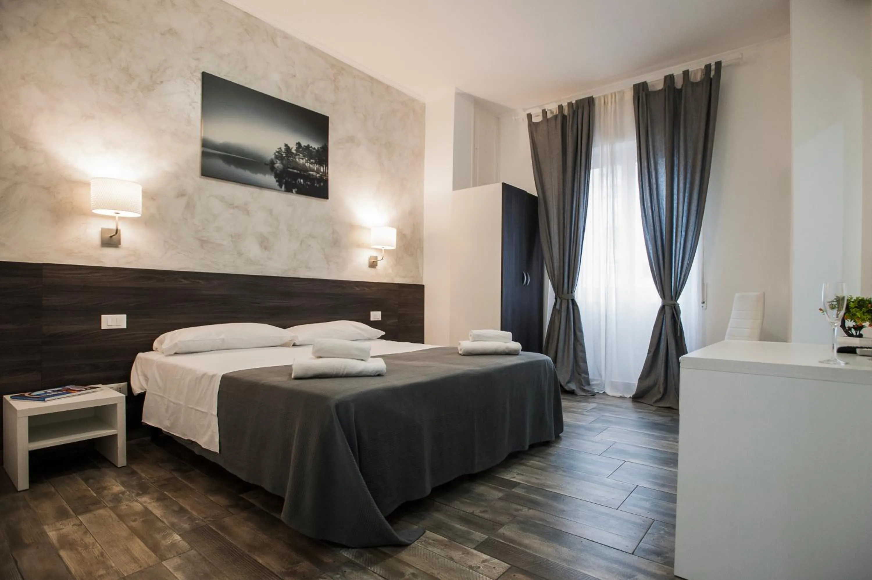 Bed in TIBURTINA INN GUEST HOUSE
