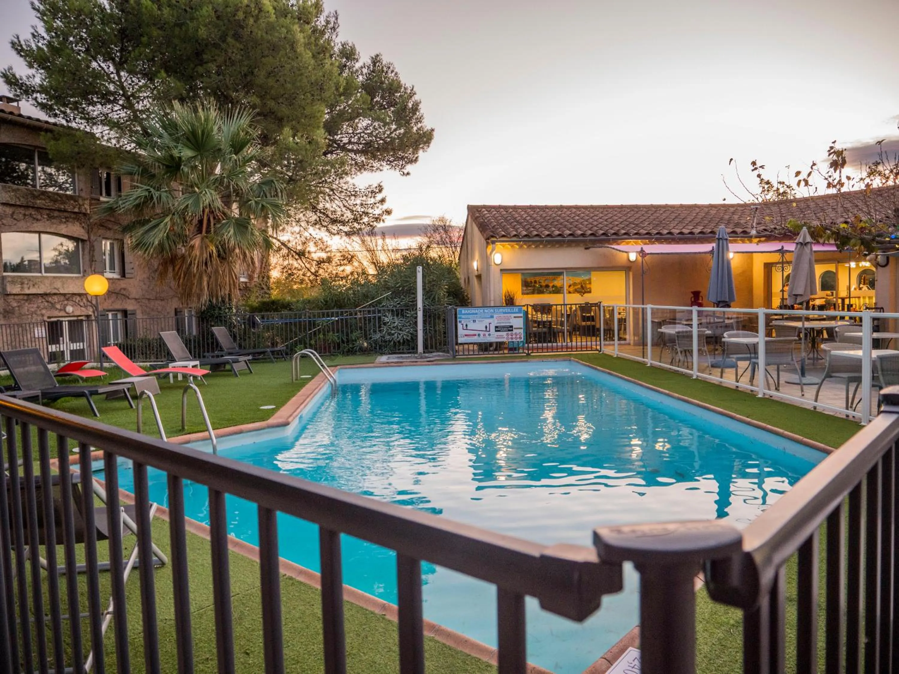 Swimming pool in Logis Hotel Restaurant Uzès Pont du Gard