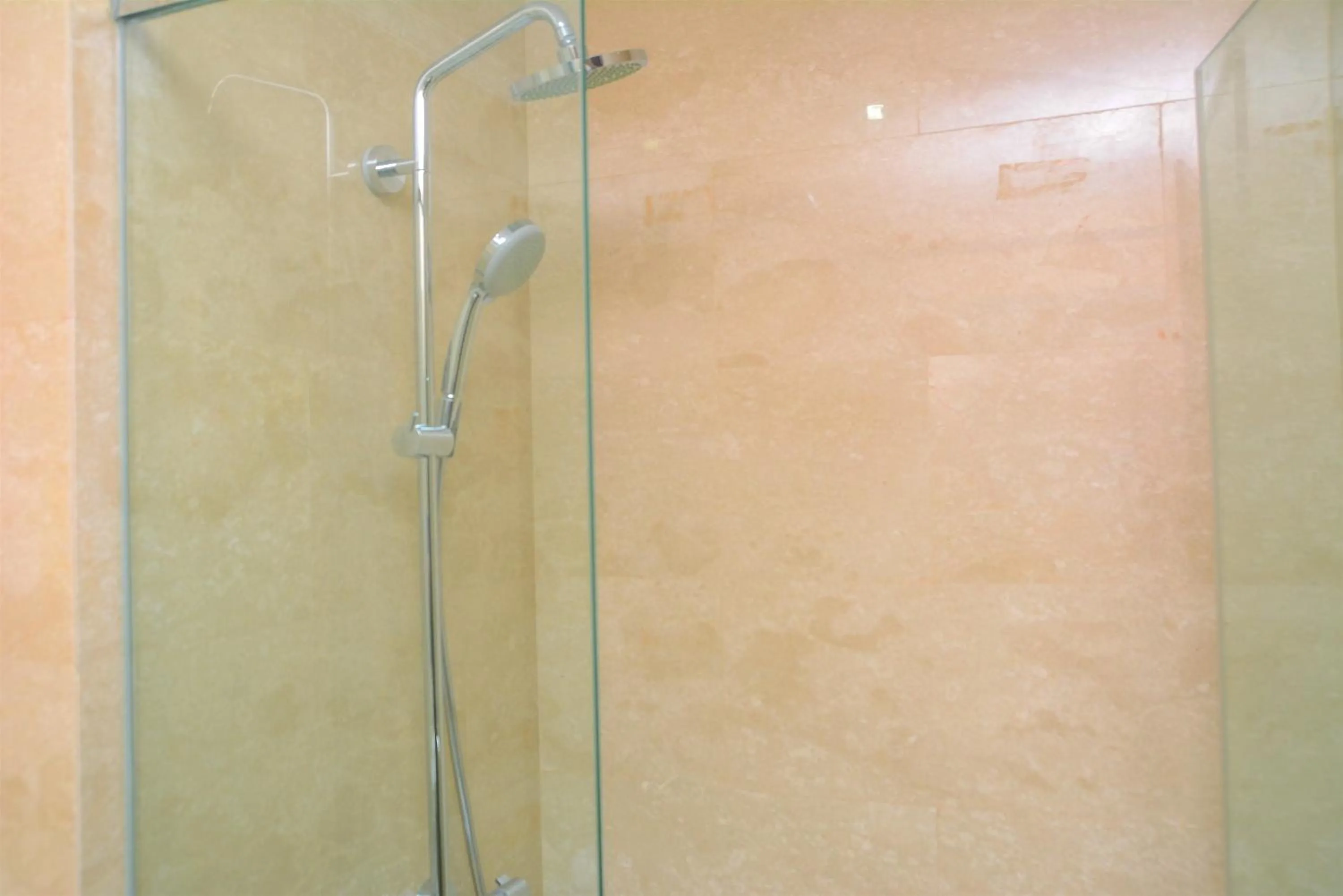 Bathroom in Modern and Cozy Studio Menteng Park Apartment By Travelio