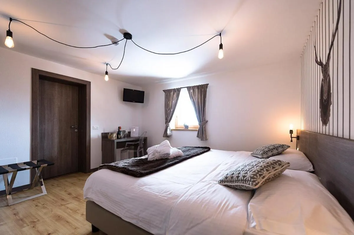 Bed in Hotel Pordoi Passo Pordoi Vegetarian Hotel