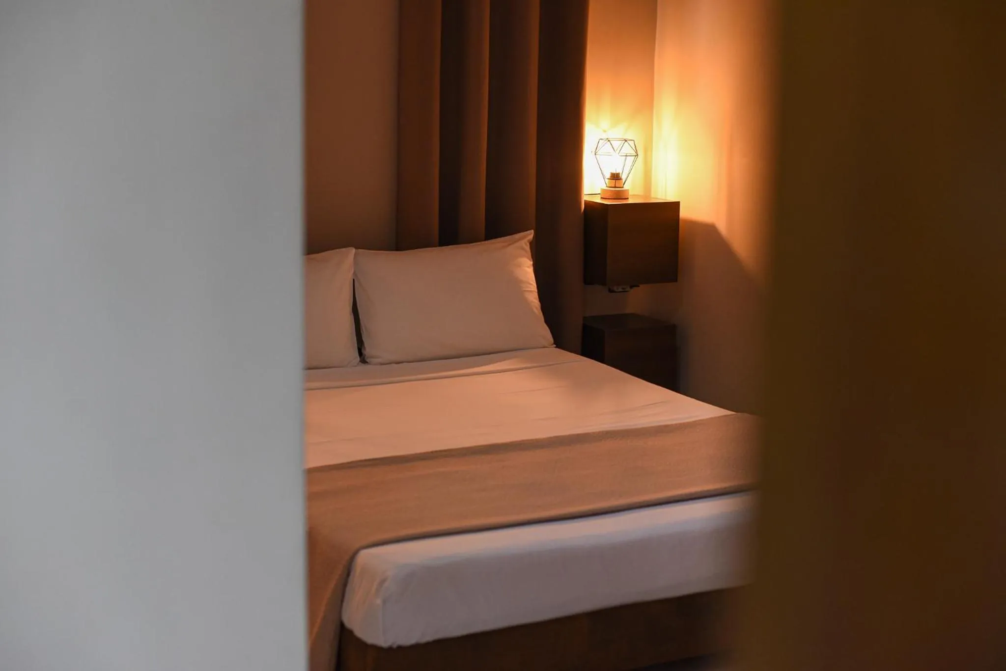 Bed in Vasilios Marinos Rooms