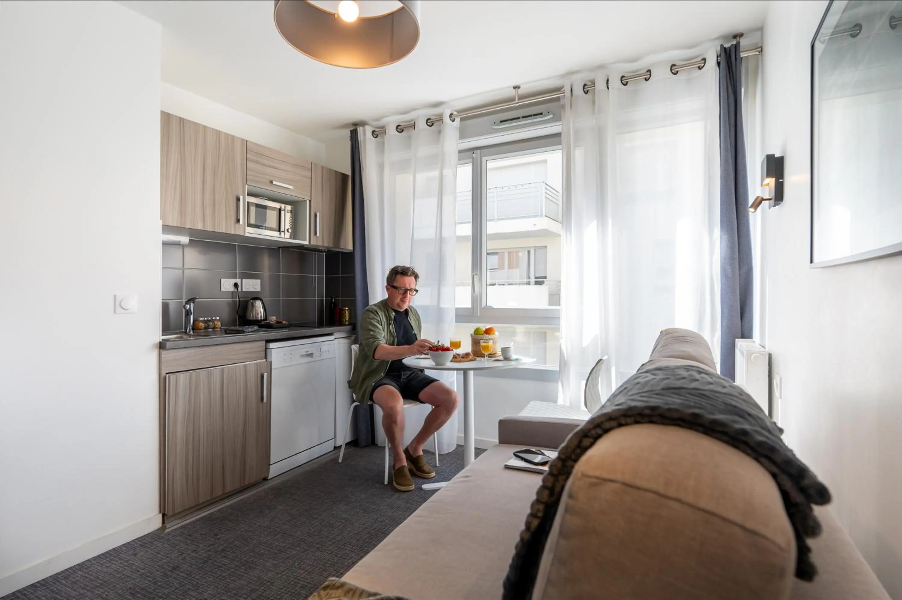 Kitchen or kitchenette in Nemea Appart Hotel Grand Cœur Nancy Centre