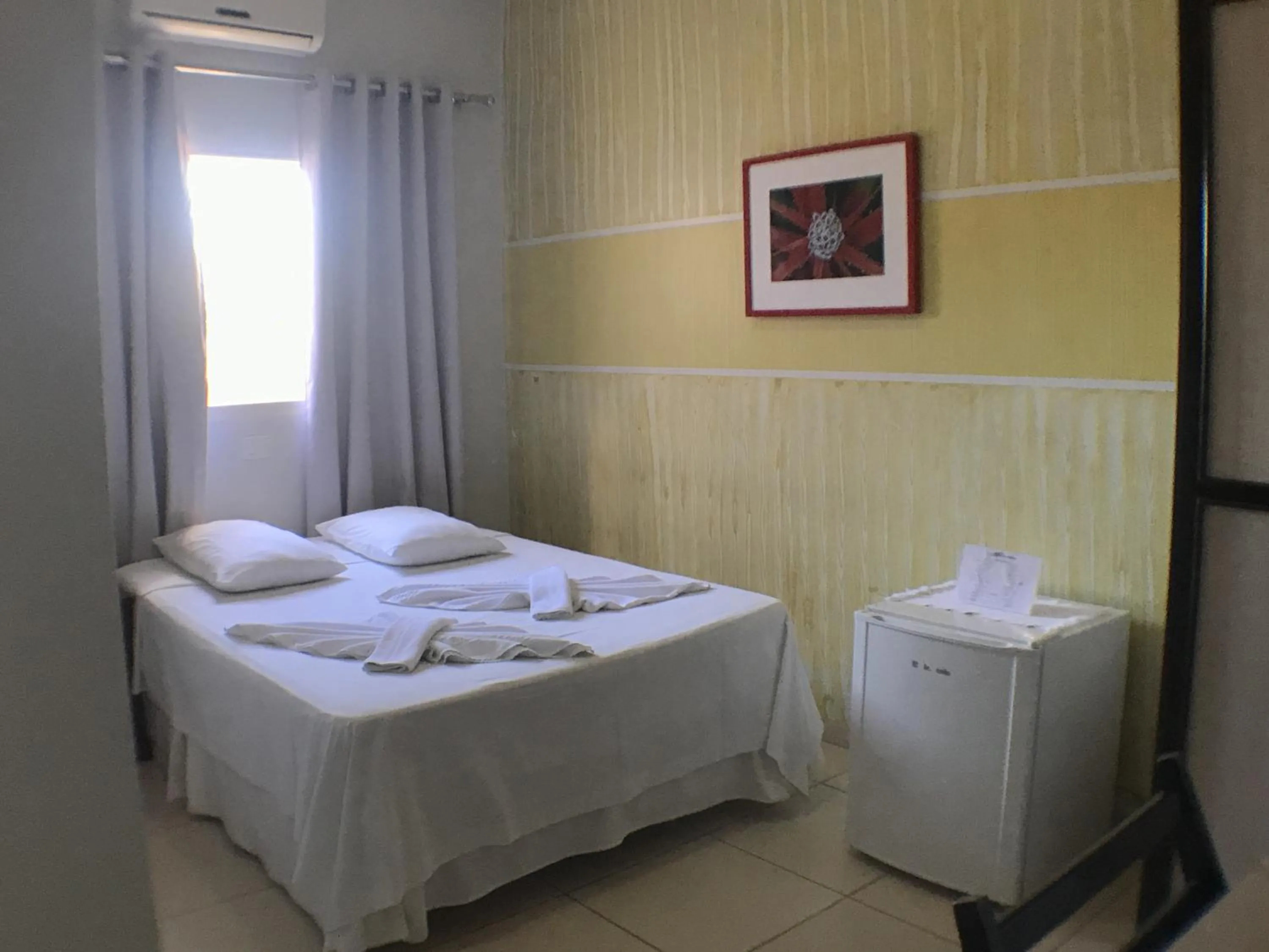 Bed in Hotel Pousada Calliandra