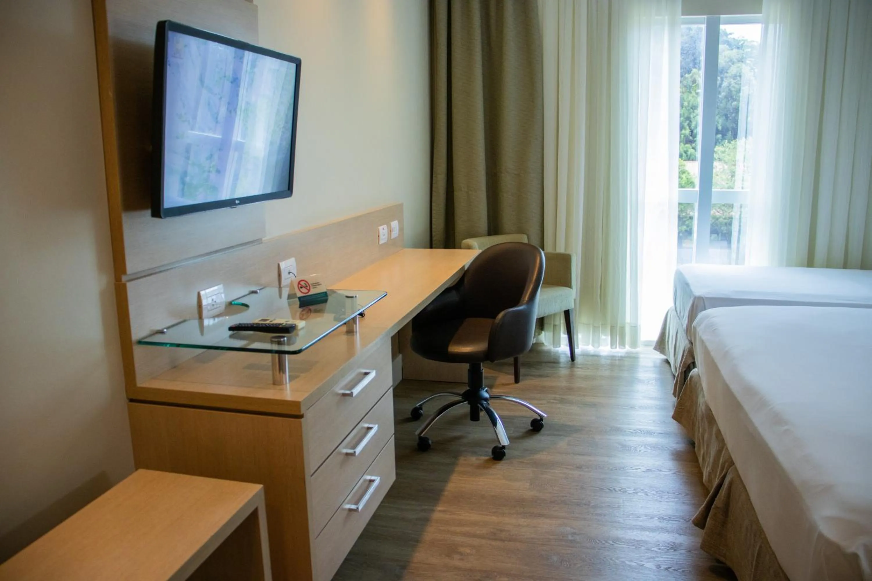 Bed in Kayrós Business Hotel