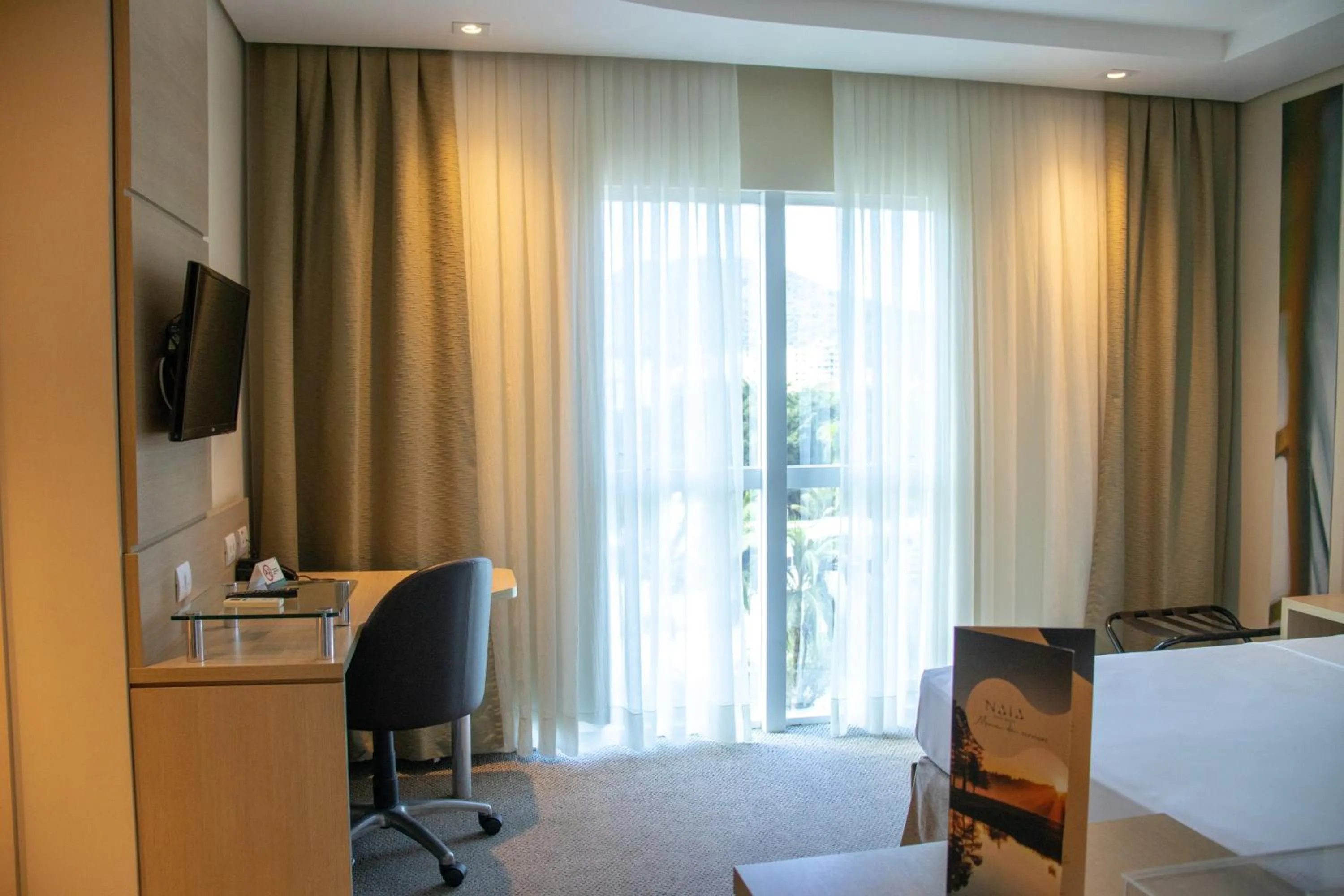 Bed in Kayrós Business Hotel