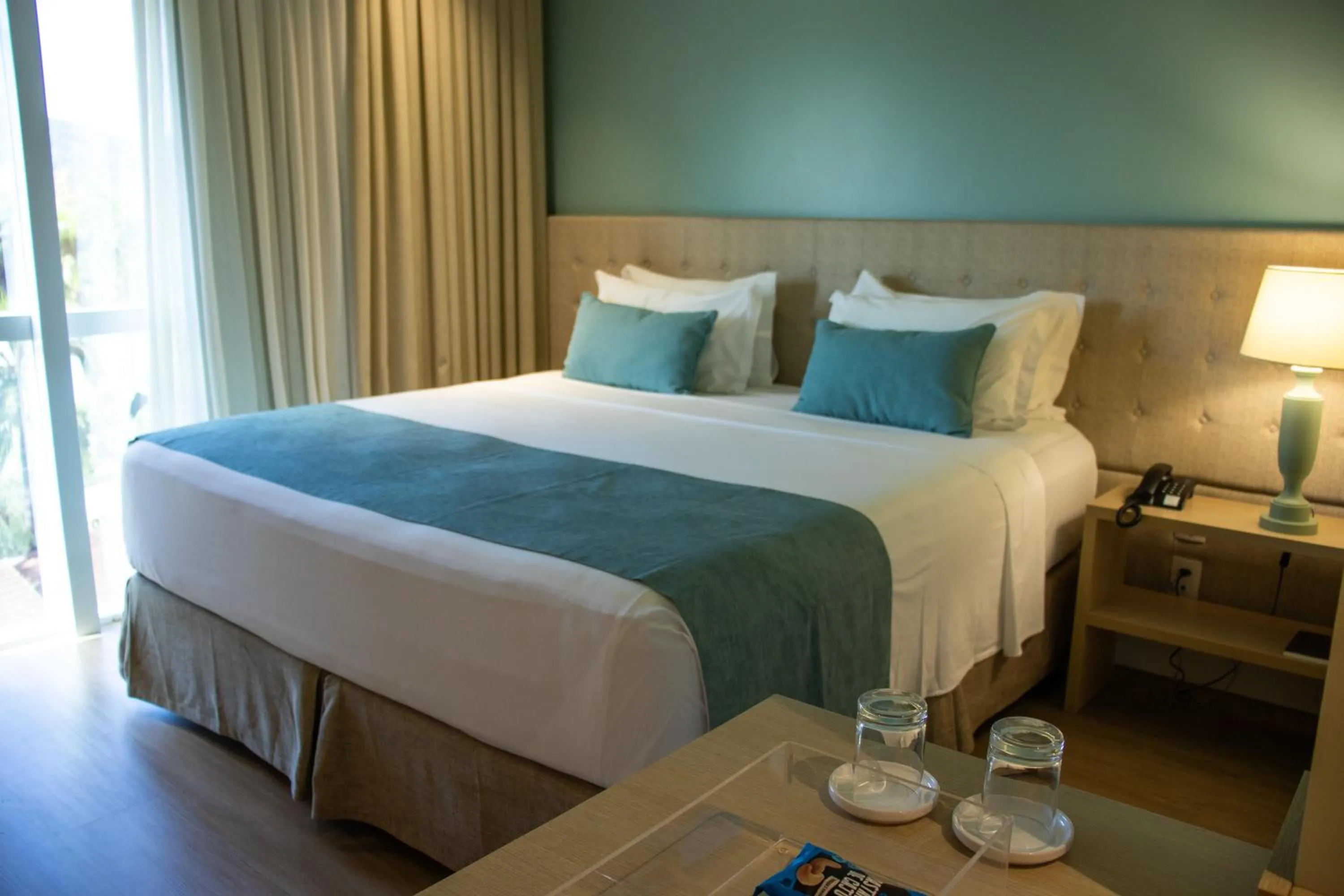 Bed in Kayrós Business Hotel