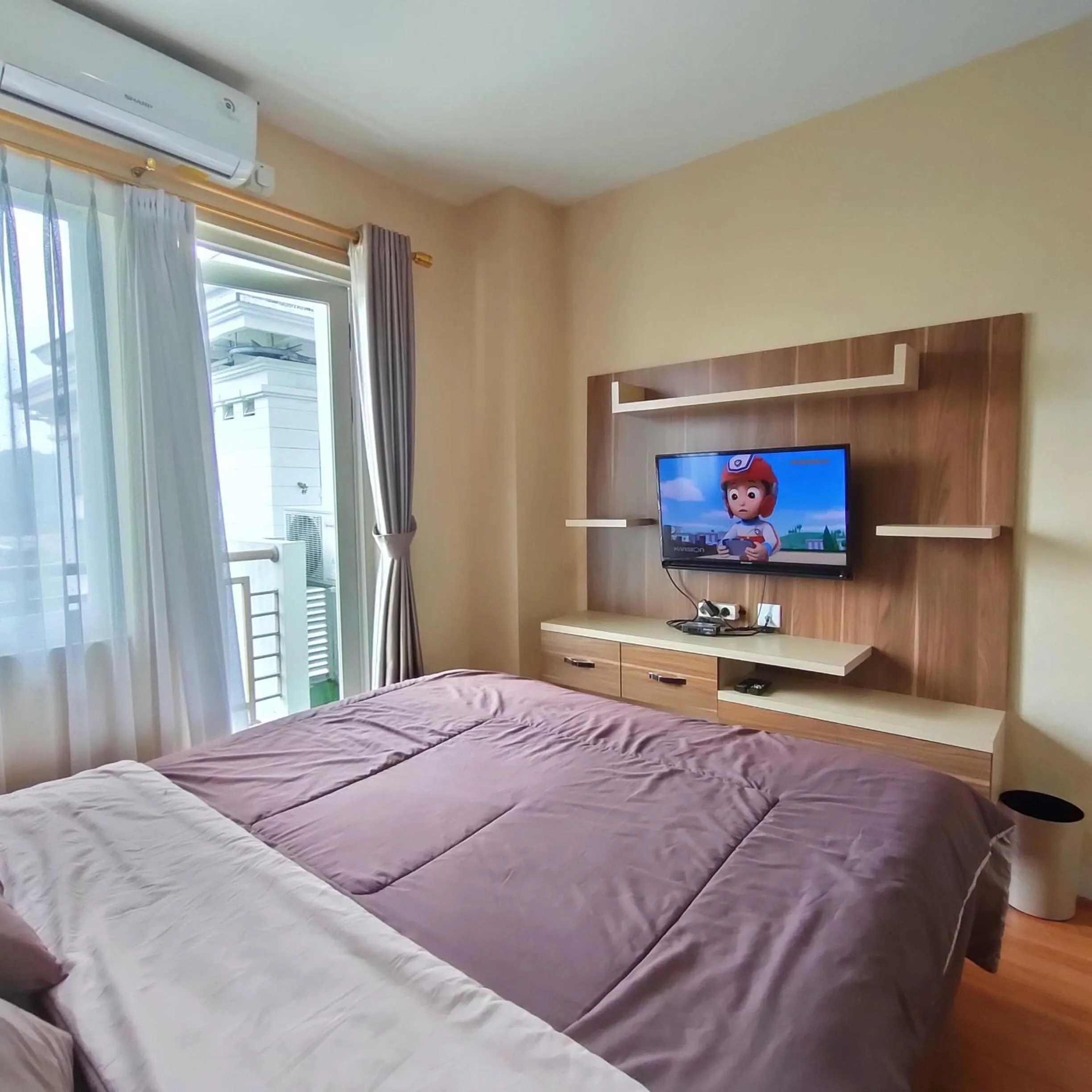 TV and multimedia, Bed in Kozy Room Sentul Tower Apartemen