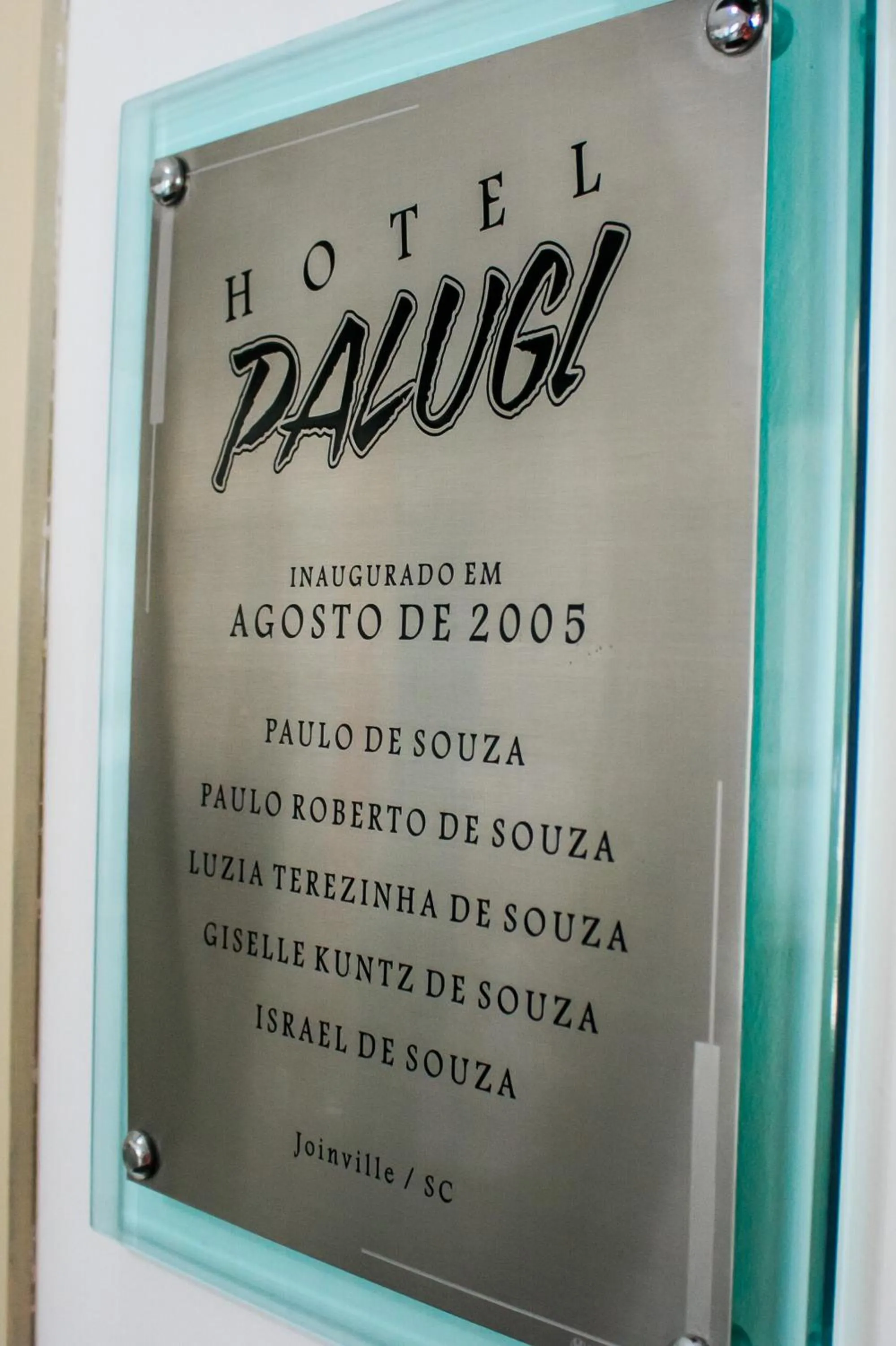 Property logo or sign in Hotel Palugi