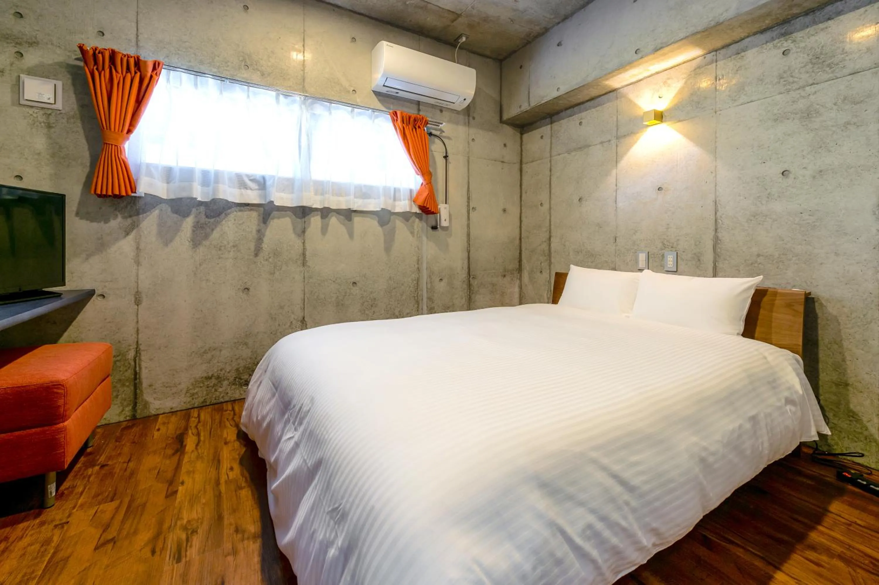 Bed in Hotel Little Island Okinawa Matsuyama