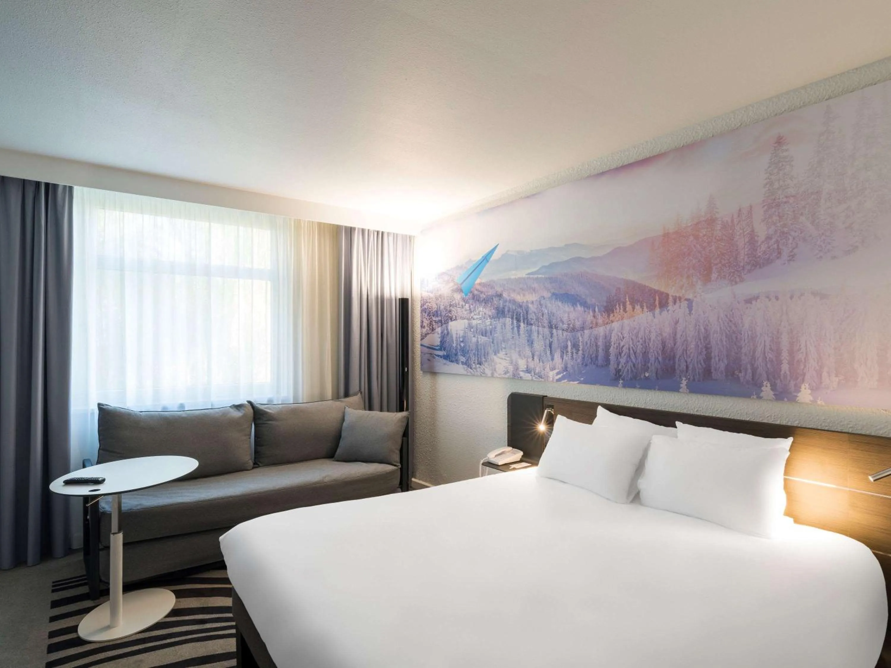 Photo of the whole room, Bed in Novotel Lyon Bron Meeting & Events