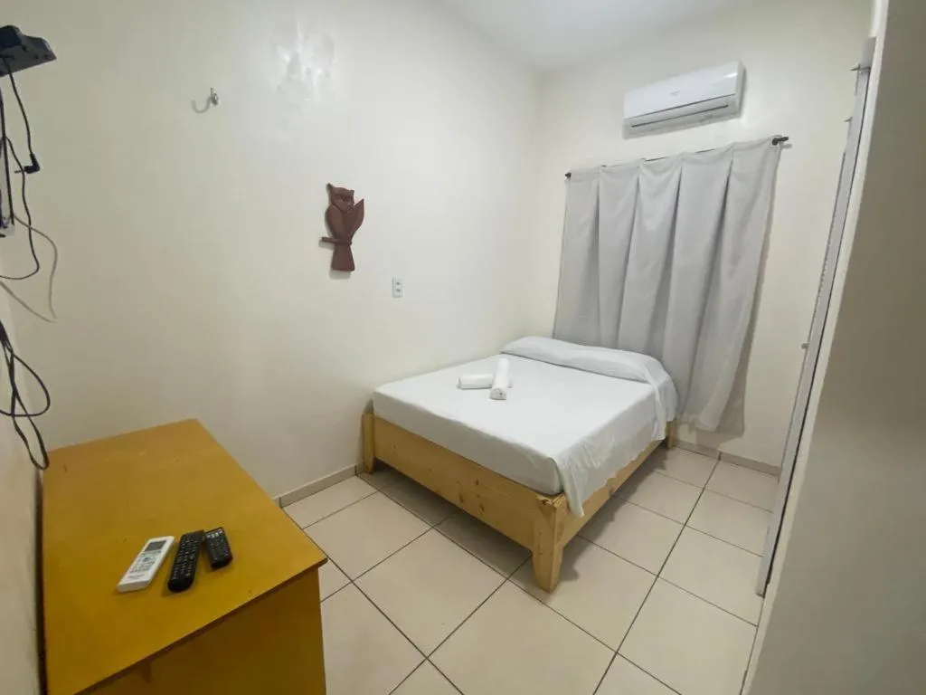 Bed in Pousada Casa da Cion