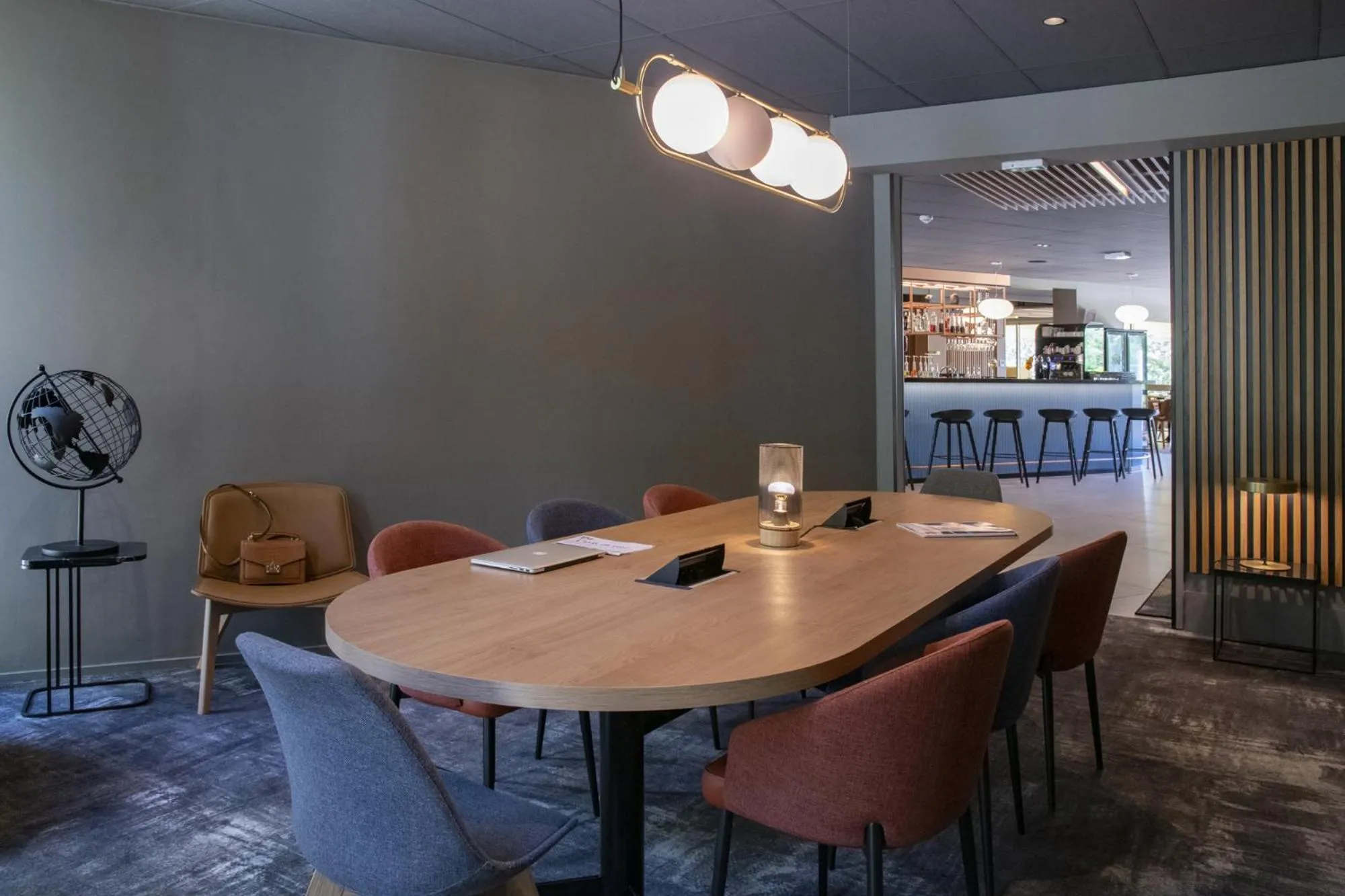 Communal lounge/ TV room in Novotel Antibes Sophia Antipolis