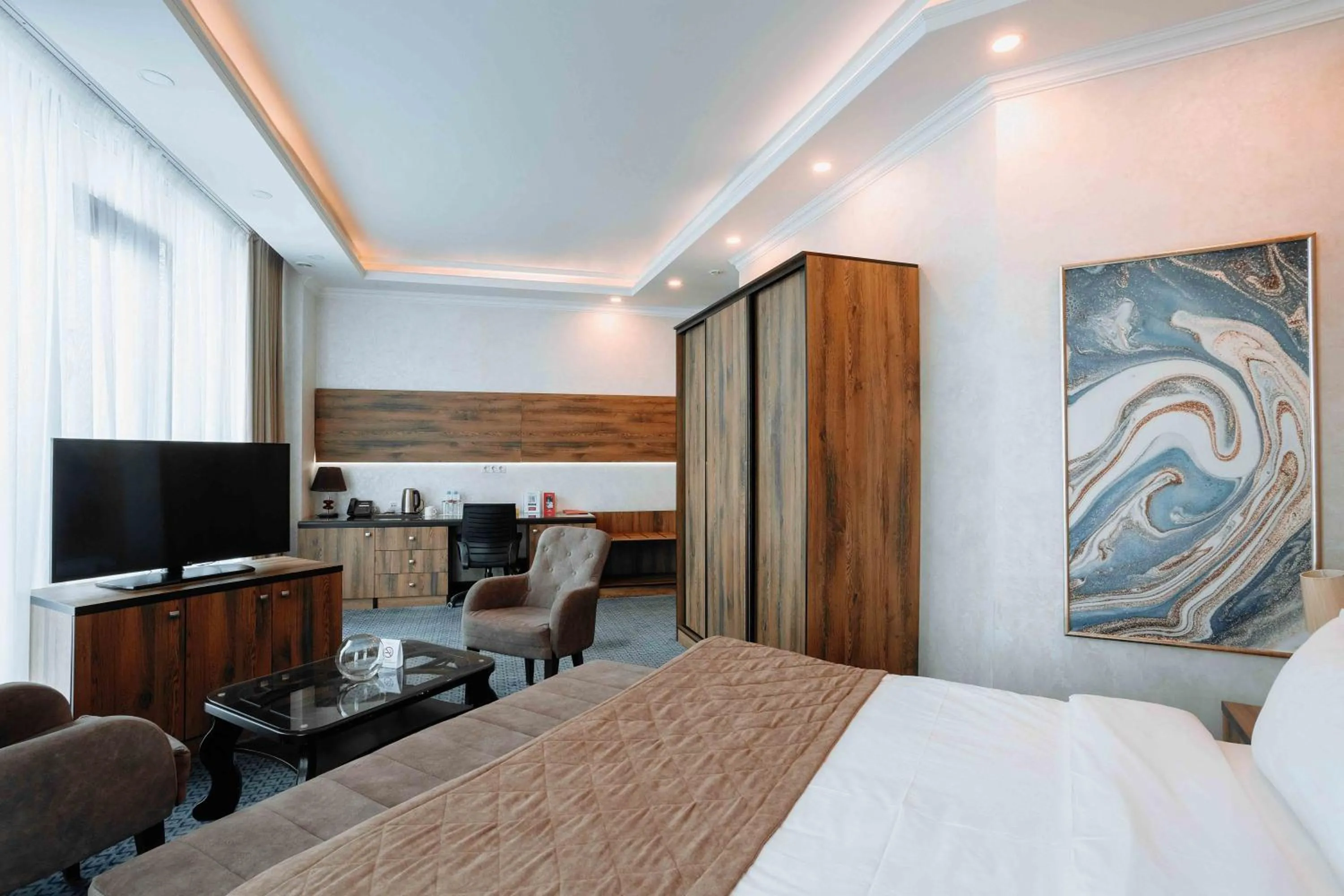 TV and multimedia, Bed in Ramada by Wyndham Shymkent