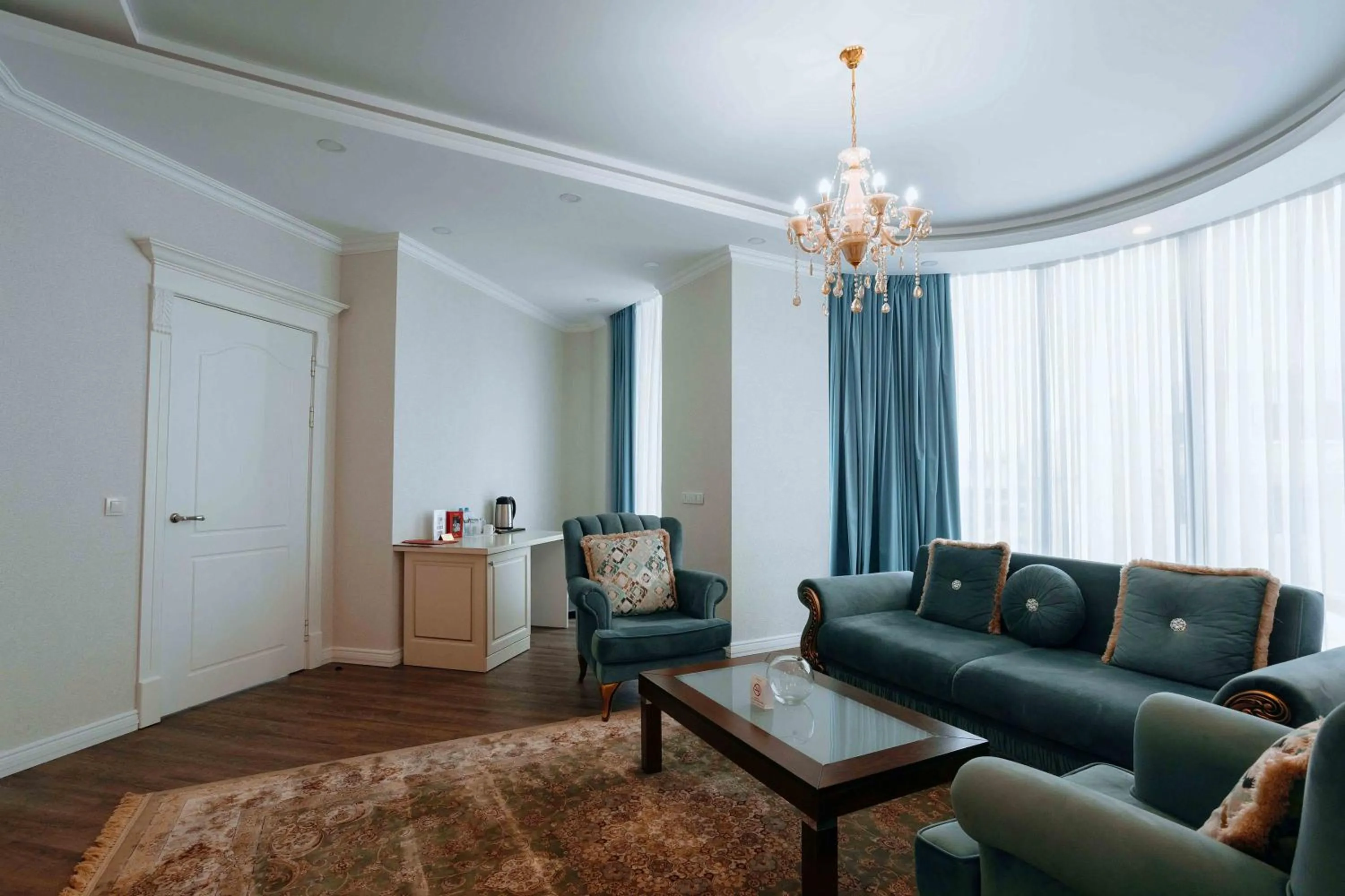 Living room in Ramada by Wyndham Shymkent