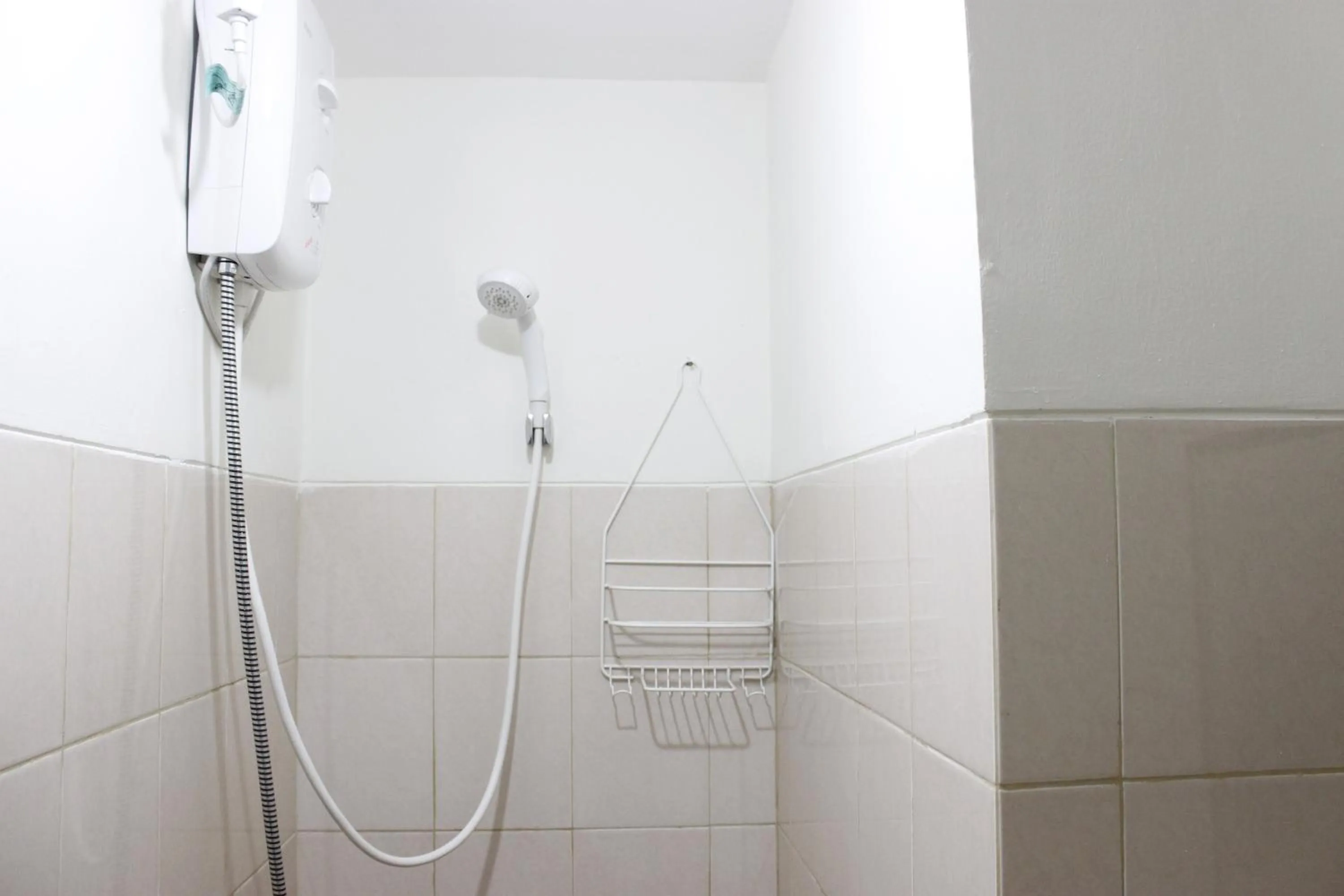 Bathroom in Compact Studio Tamansari Panoramic Apartment By Travelio