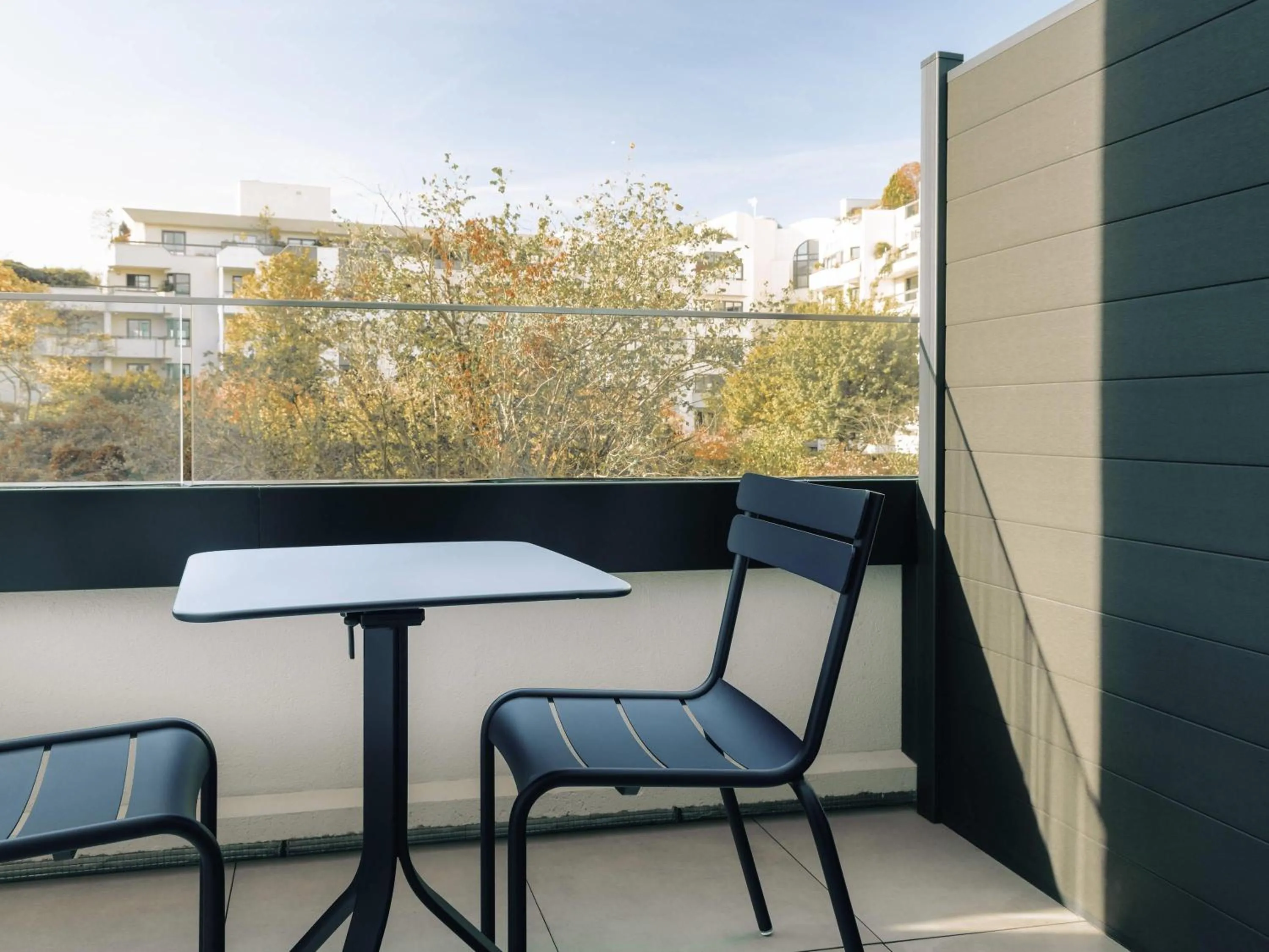 Bedroom in Novotel Paris Suresnes Longchamp