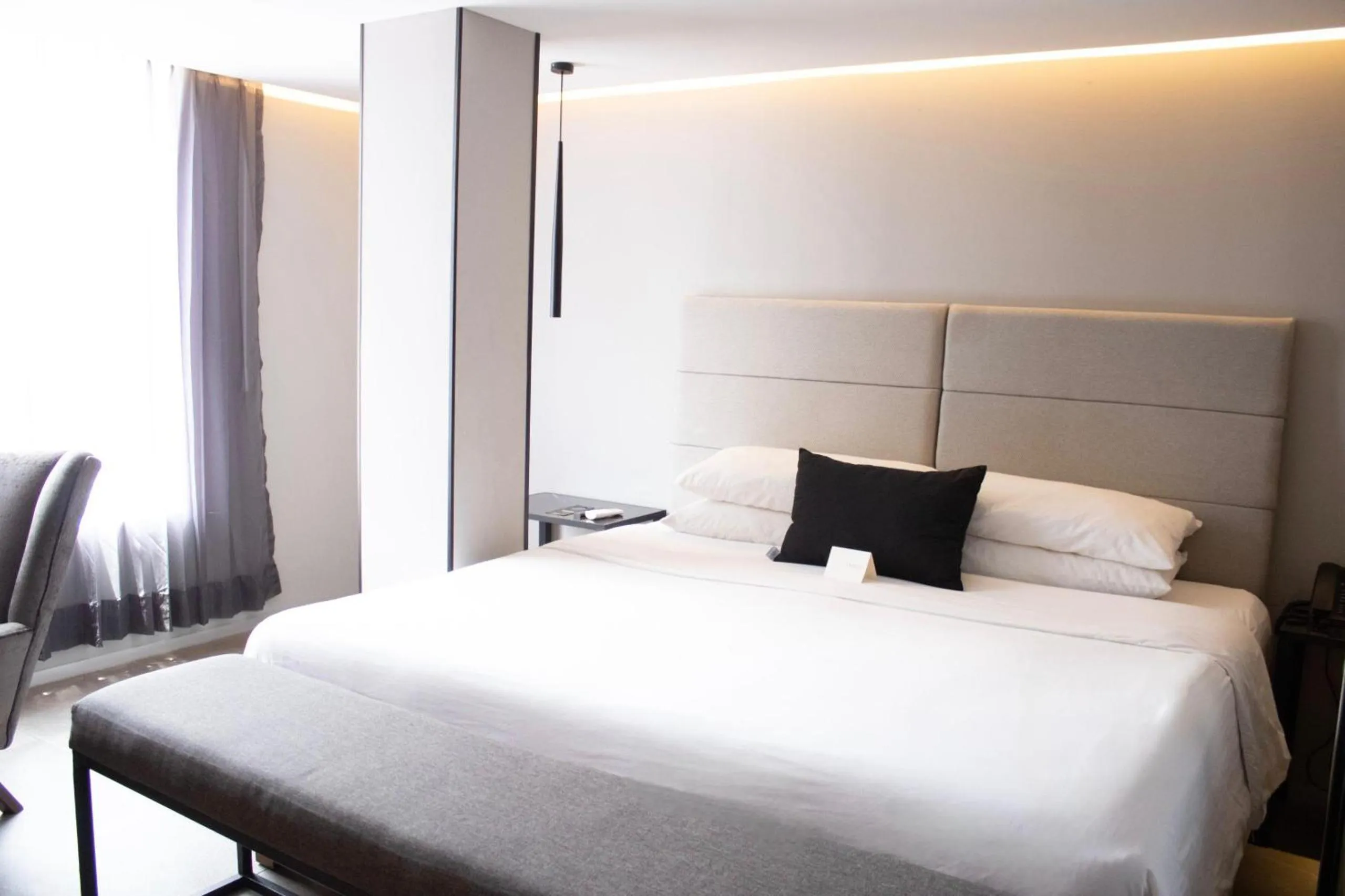 Bed in Ontico Urban Design Hotel