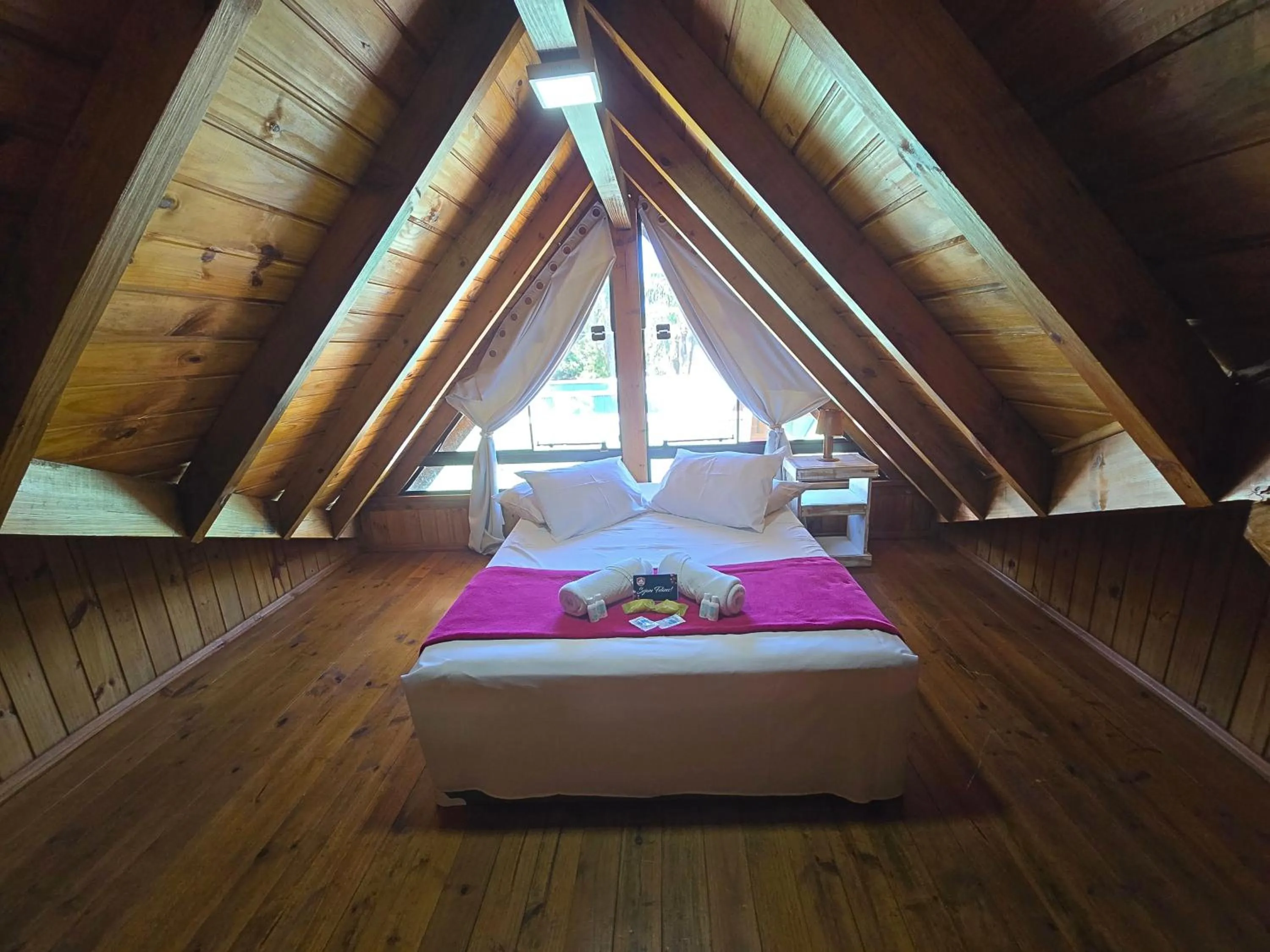 Bed in Chalé Suiço Bombinhas