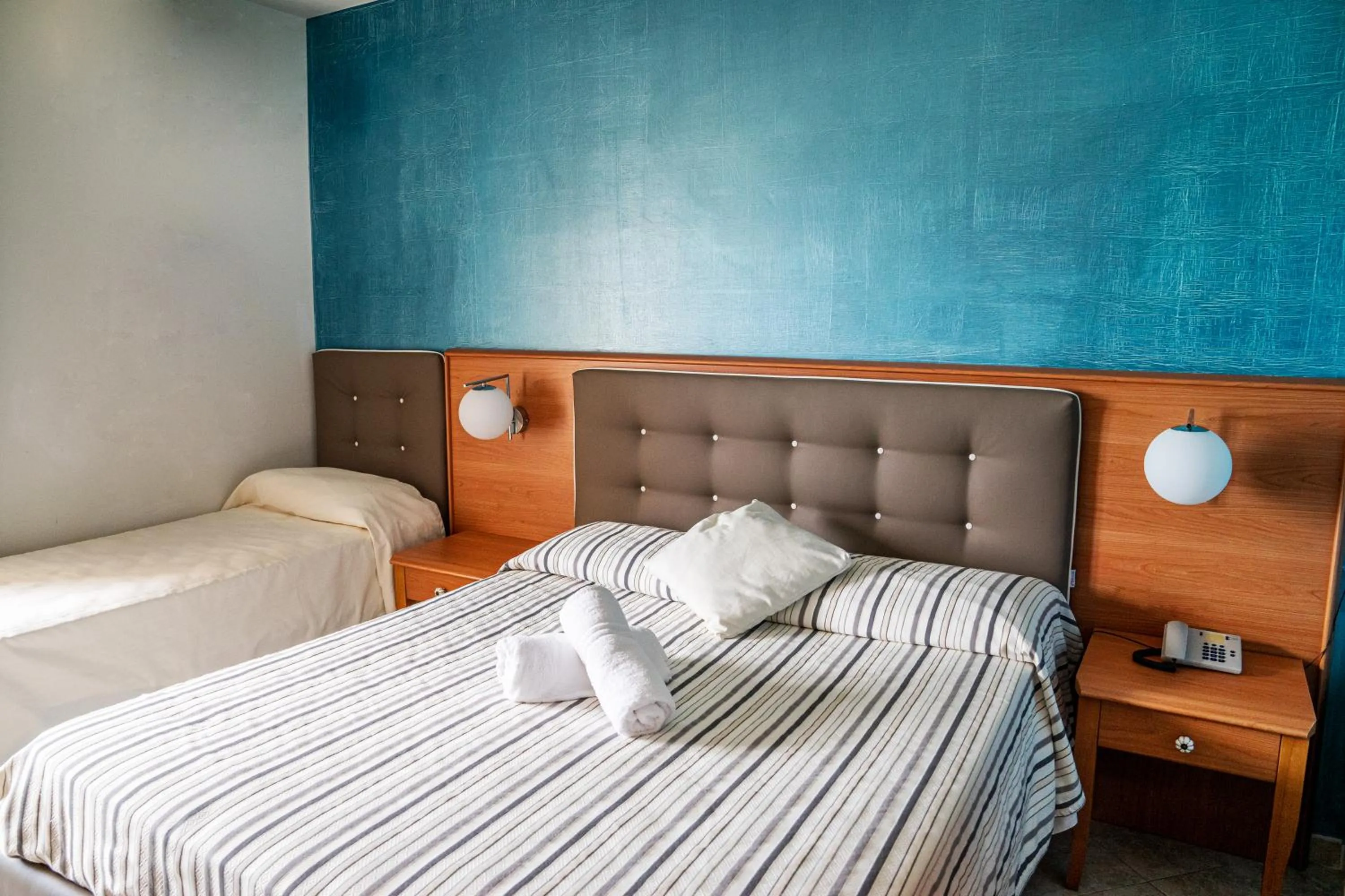 Bed in Hotel Paradiso