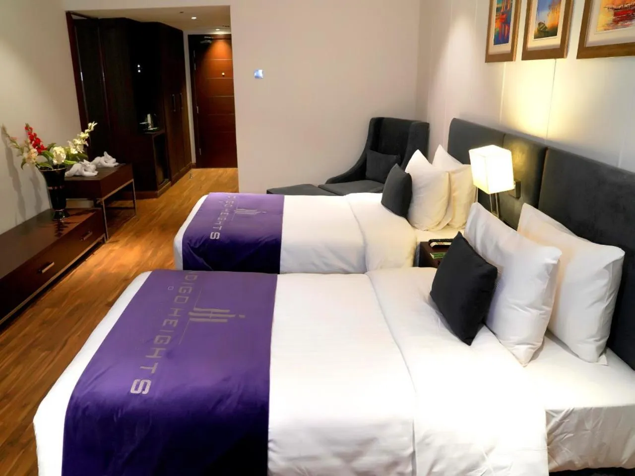 Bed in Indigo Heights Hotel & Suites