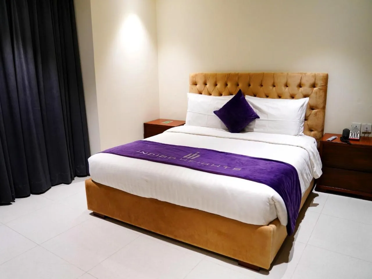 Bed in Indigo Heights Hotel & Suites