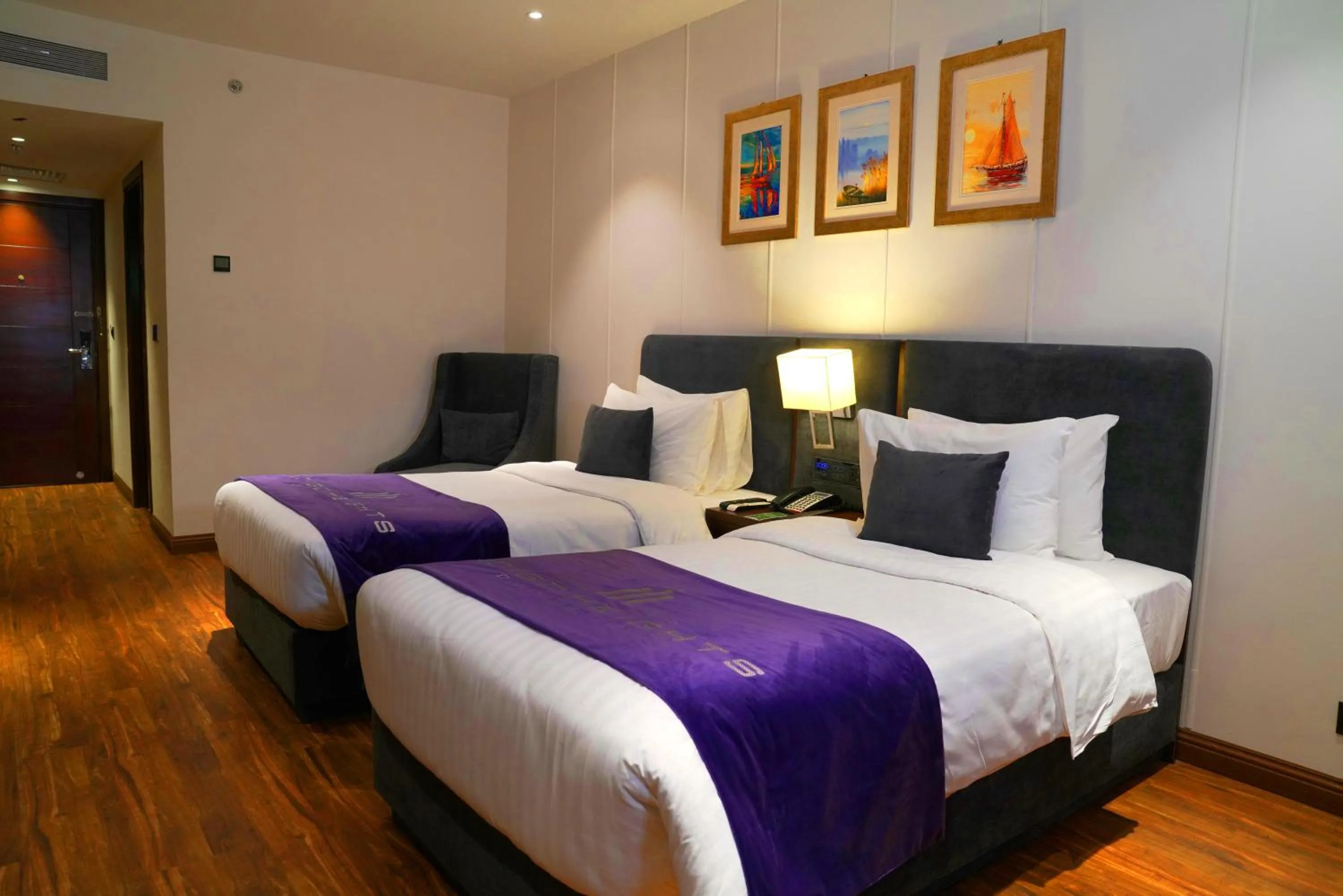 Bed in Indigo Heights Hotel & Suites