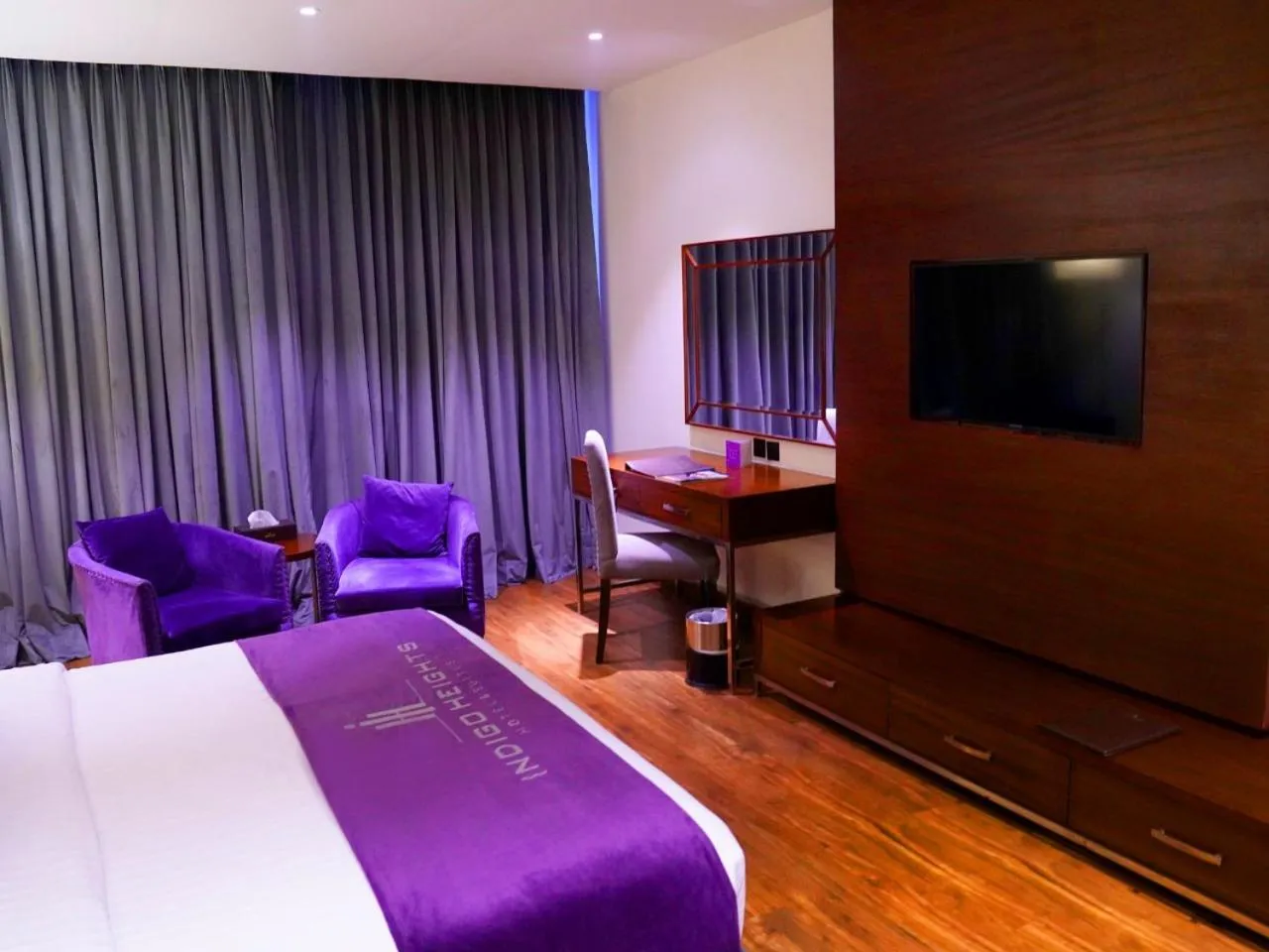 Bed in Indigo Heights Hotel & Suites