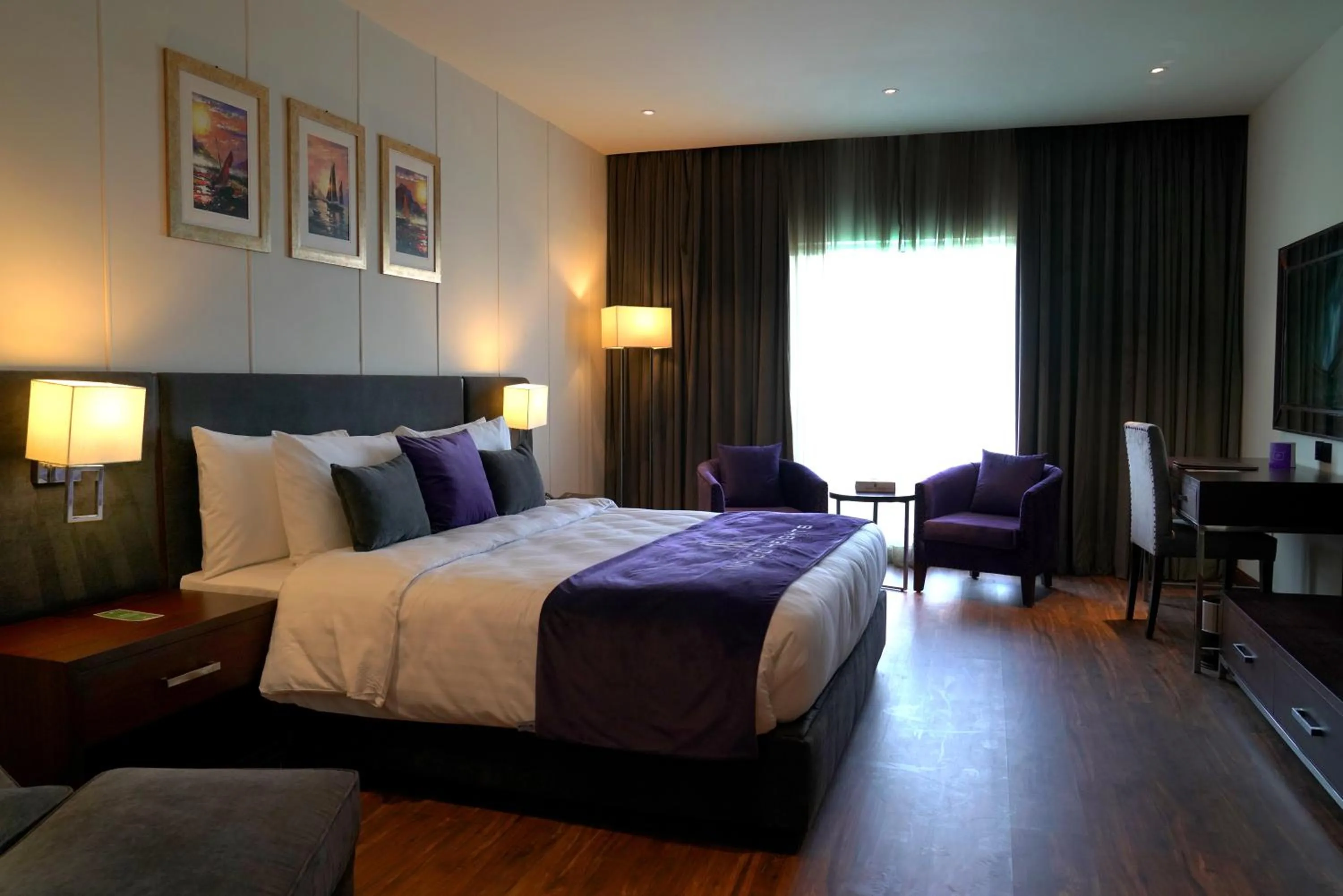 Bed in Indigo Heights Hotel & Suites