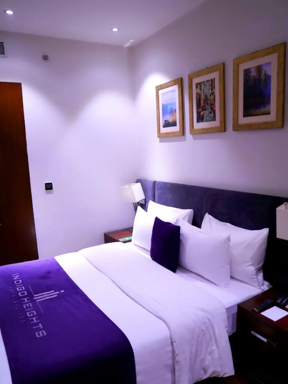 Bed in Indigo Heights Hotel & Suites