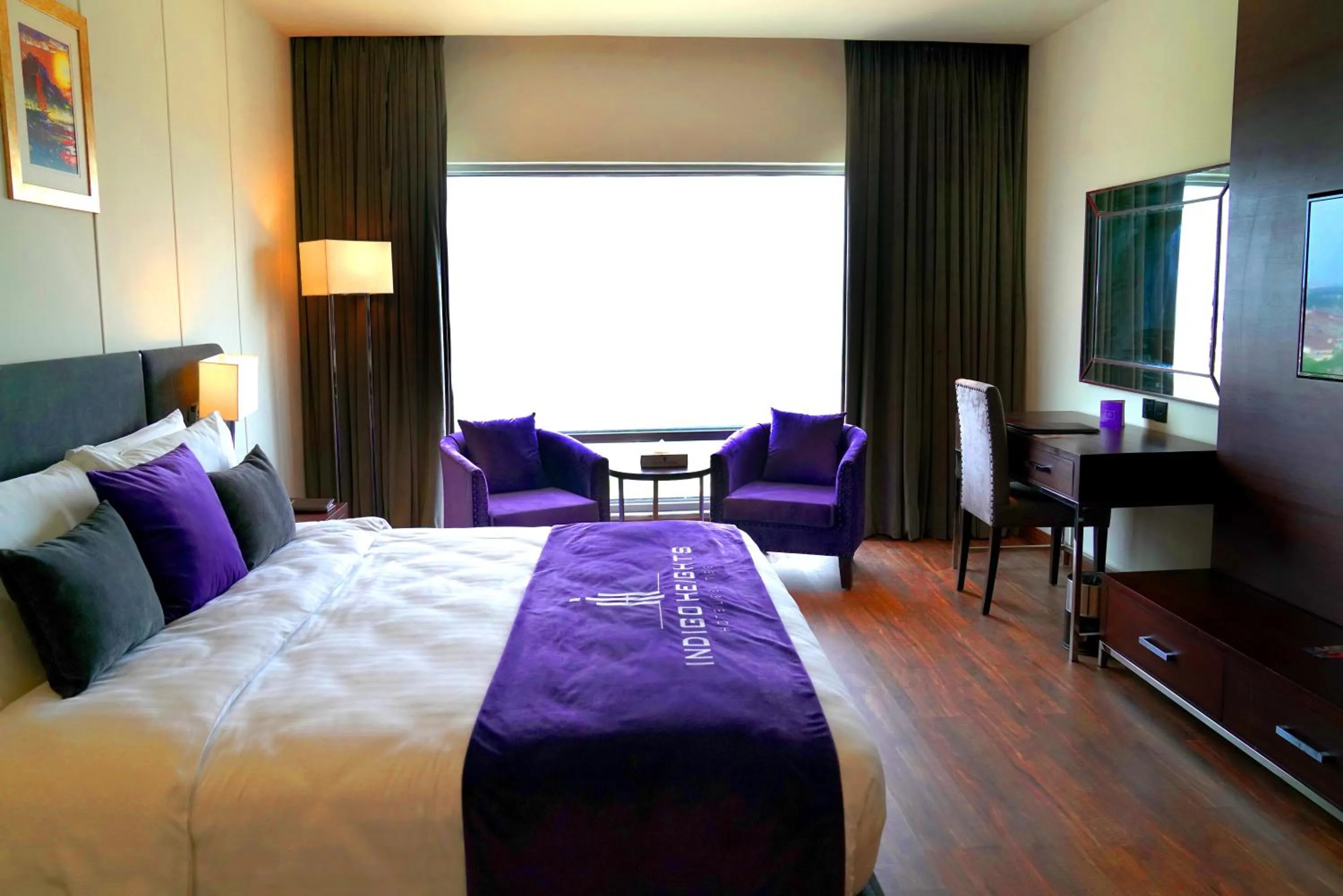 Bed in Indigo Heights Hotel & Suites