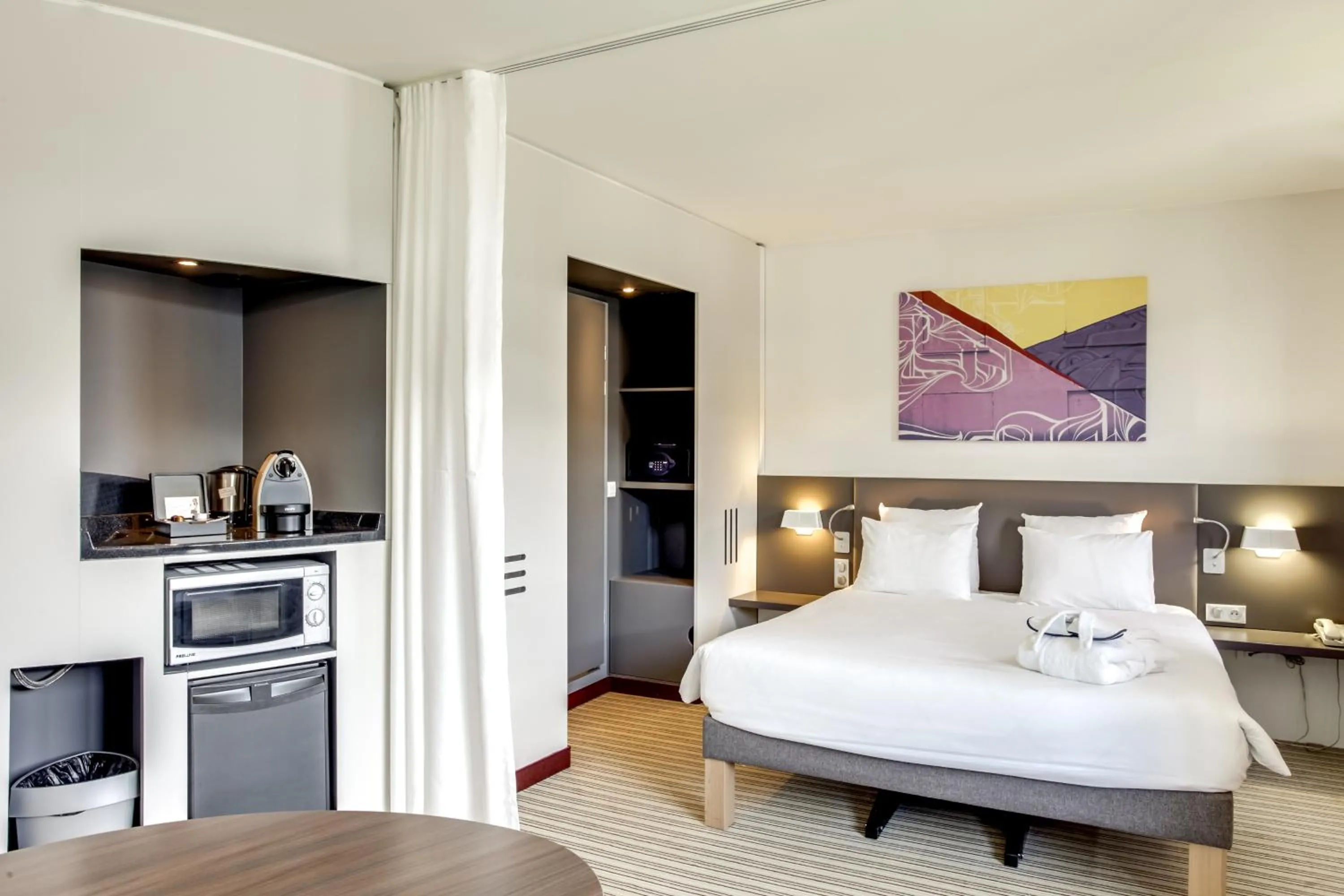 Photo of the whole room, Bed in Novotel Suites Paris Stade de France