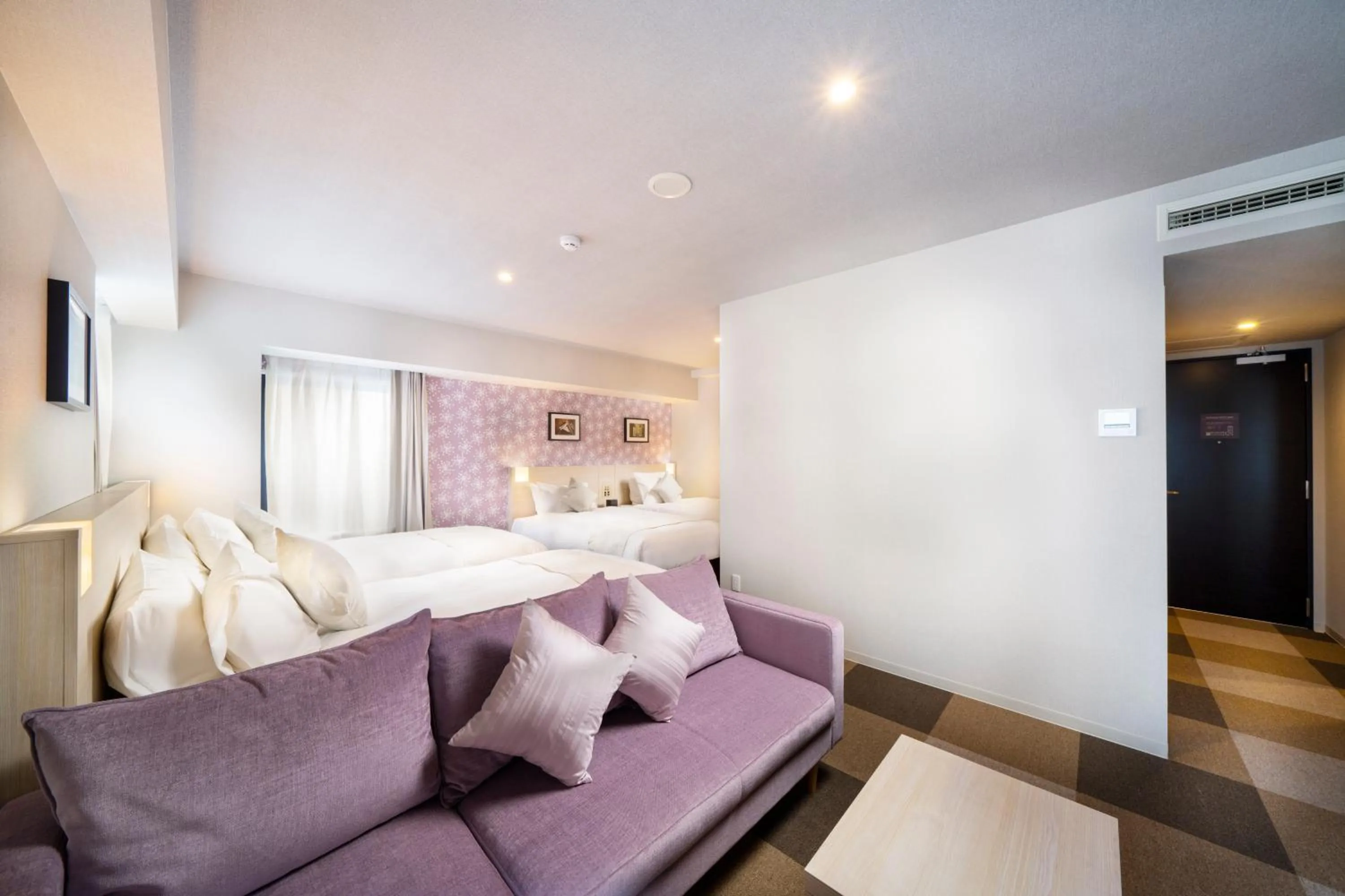 Bed in KOKO HOTEL Sapporo Odori