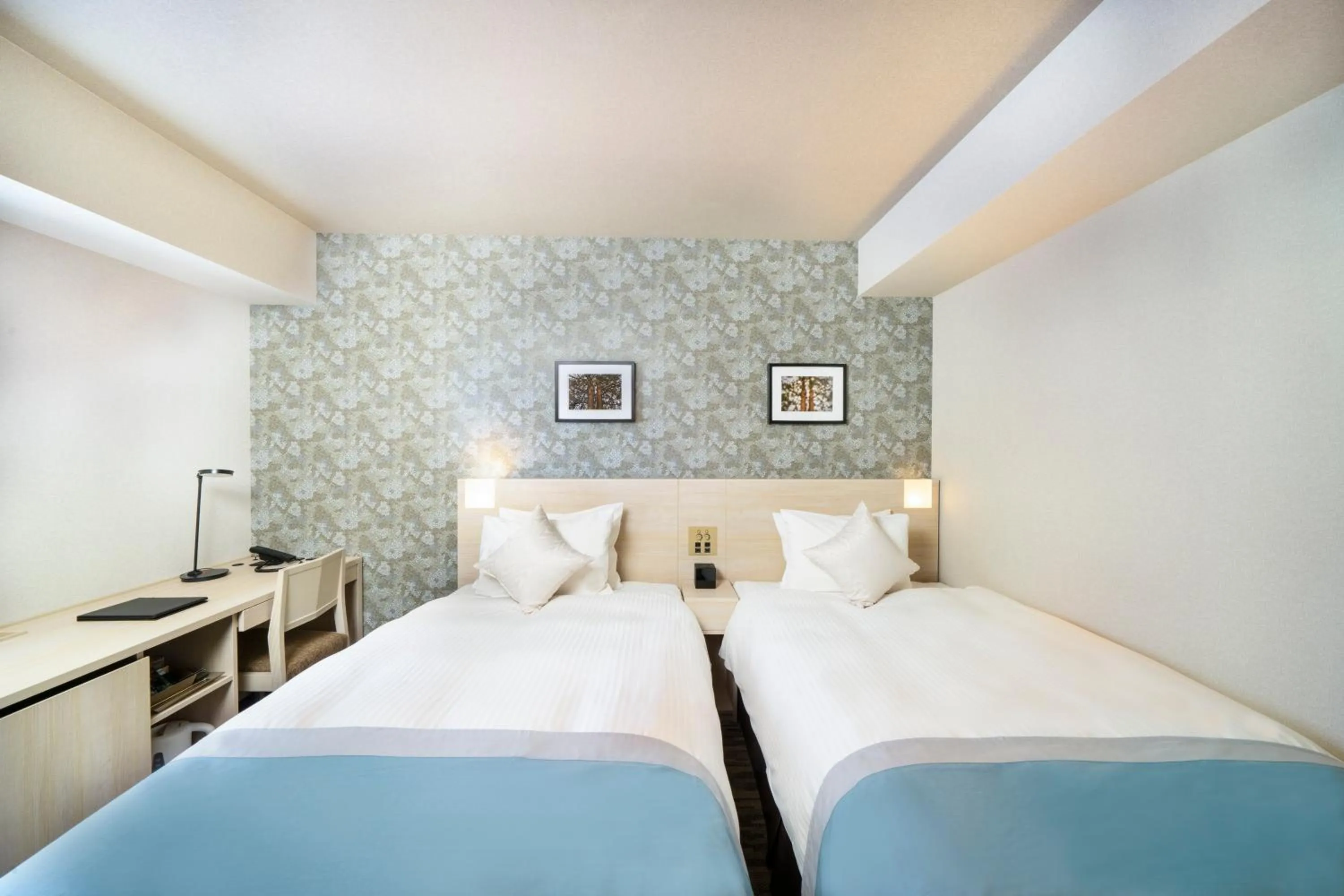 Bed in KOKO HOTEL Sapporo Odori