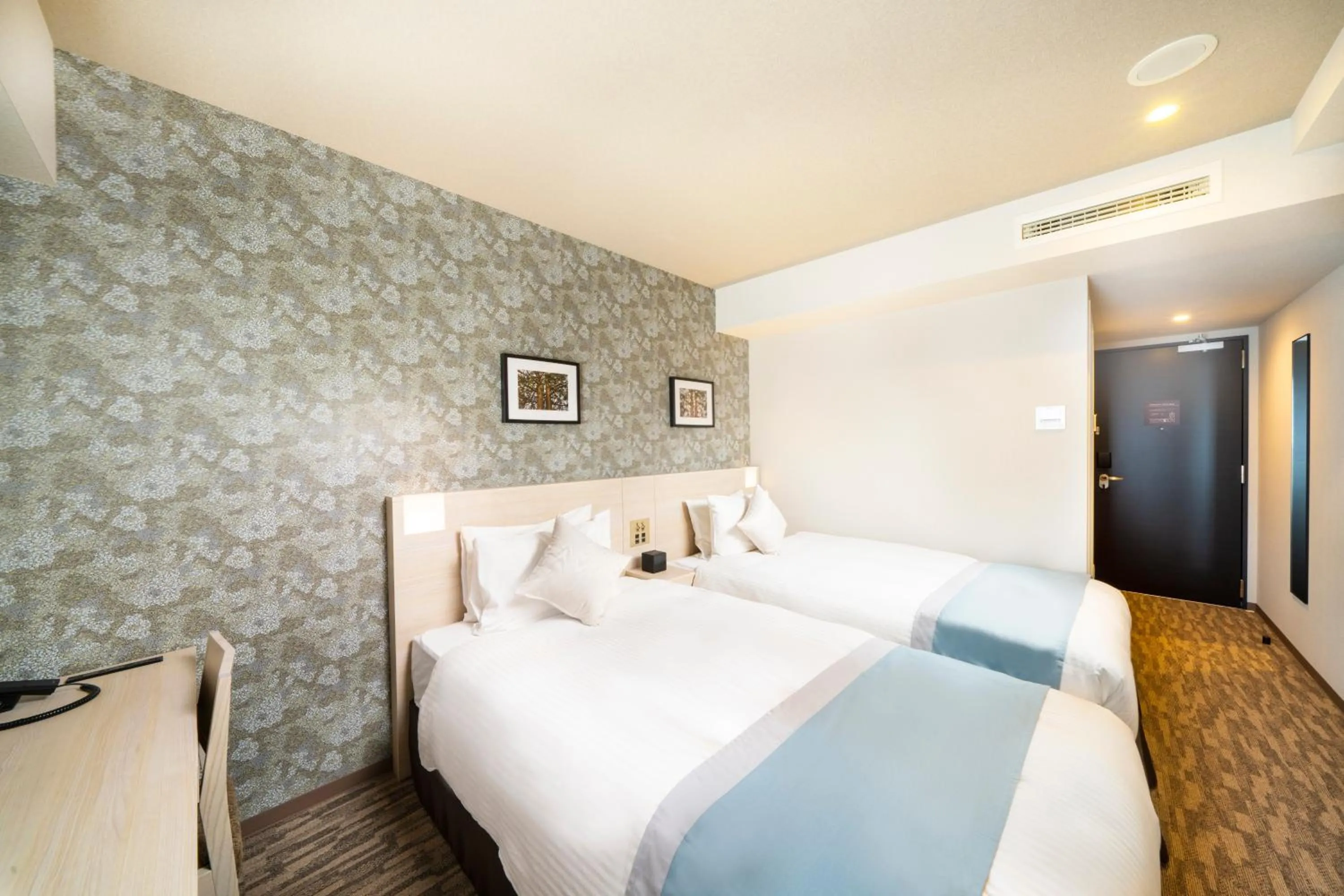 Bed in KOKO HOTEL Sapporo Odori