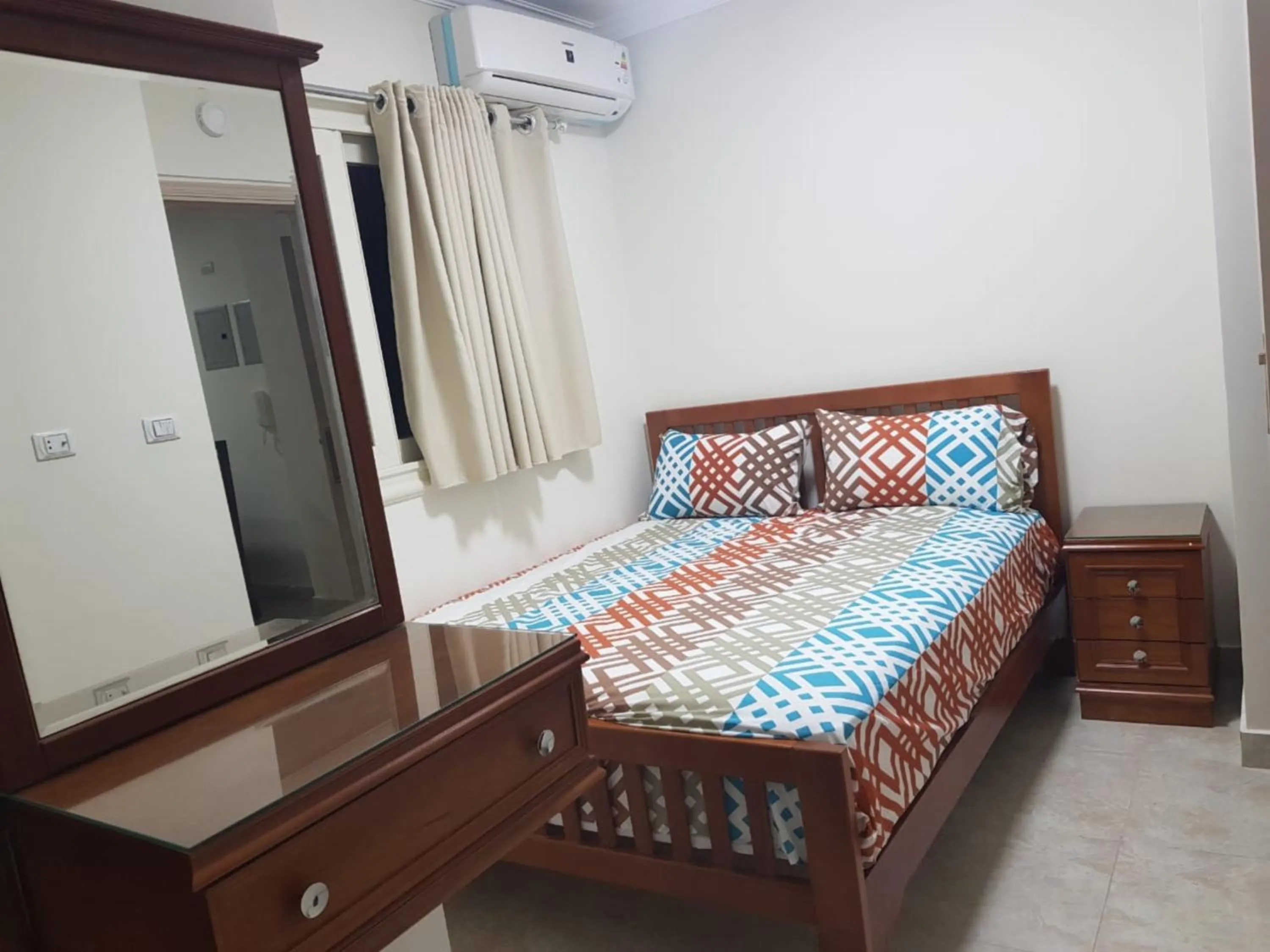 Bedroom, Bed in Al Raya Apartments