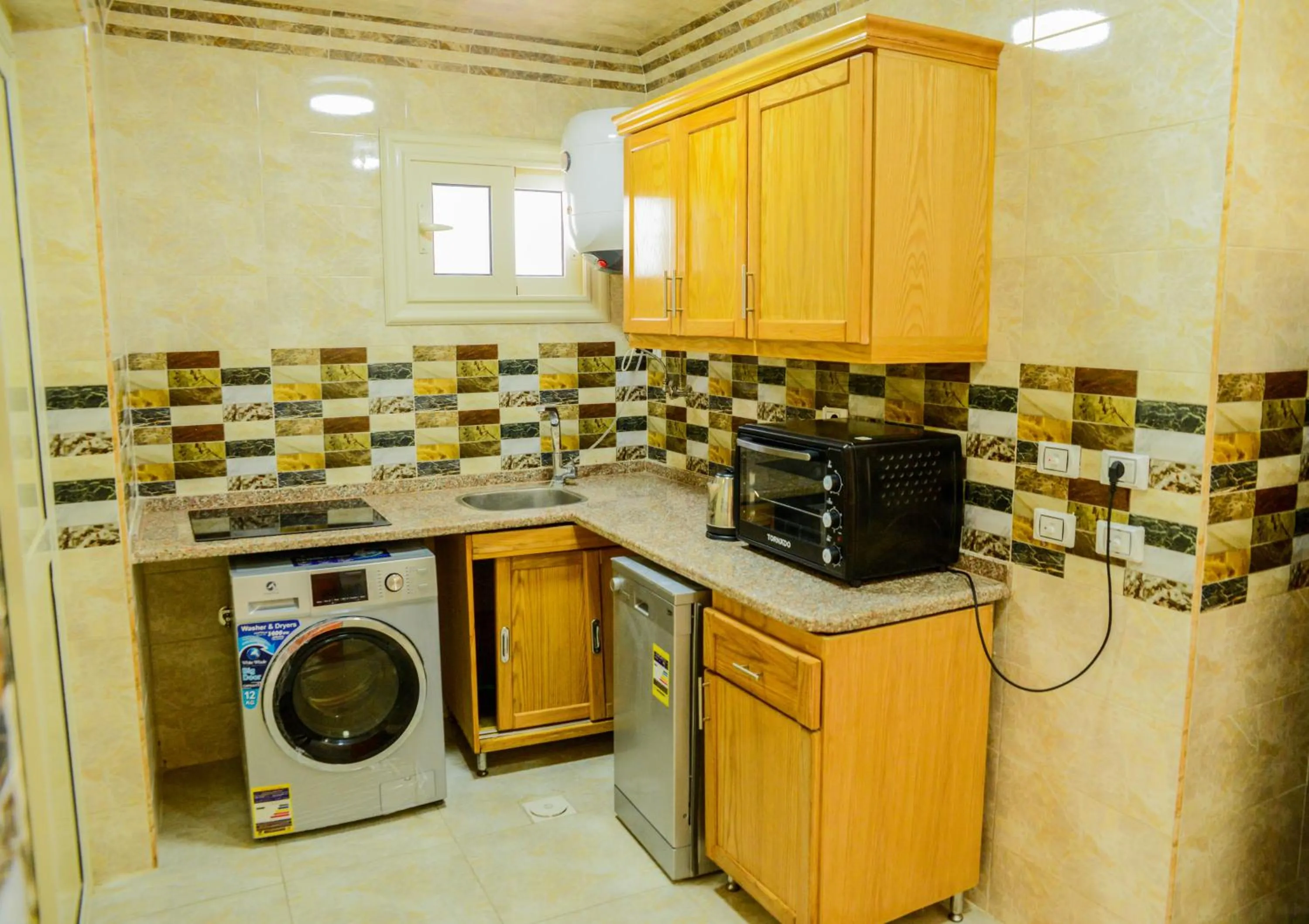 Kitchen or kitchenette in Al Raya Apartments